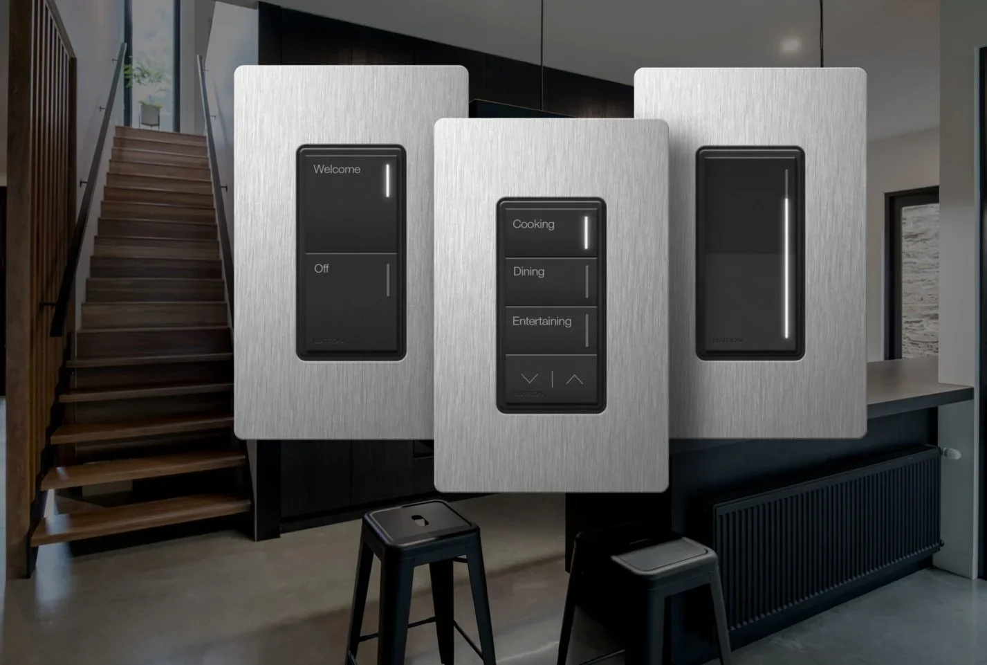 Three modern touch-screen control panels on a kitchen wall, with a staircase to the left and a window on the right side.