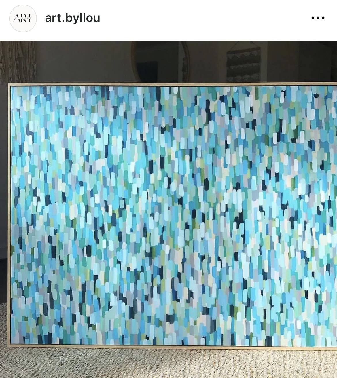 A large abstract painting with numerous small, irregularly shaped brushstrokes in shades of blue, turquoise, white, and hints of black and green.