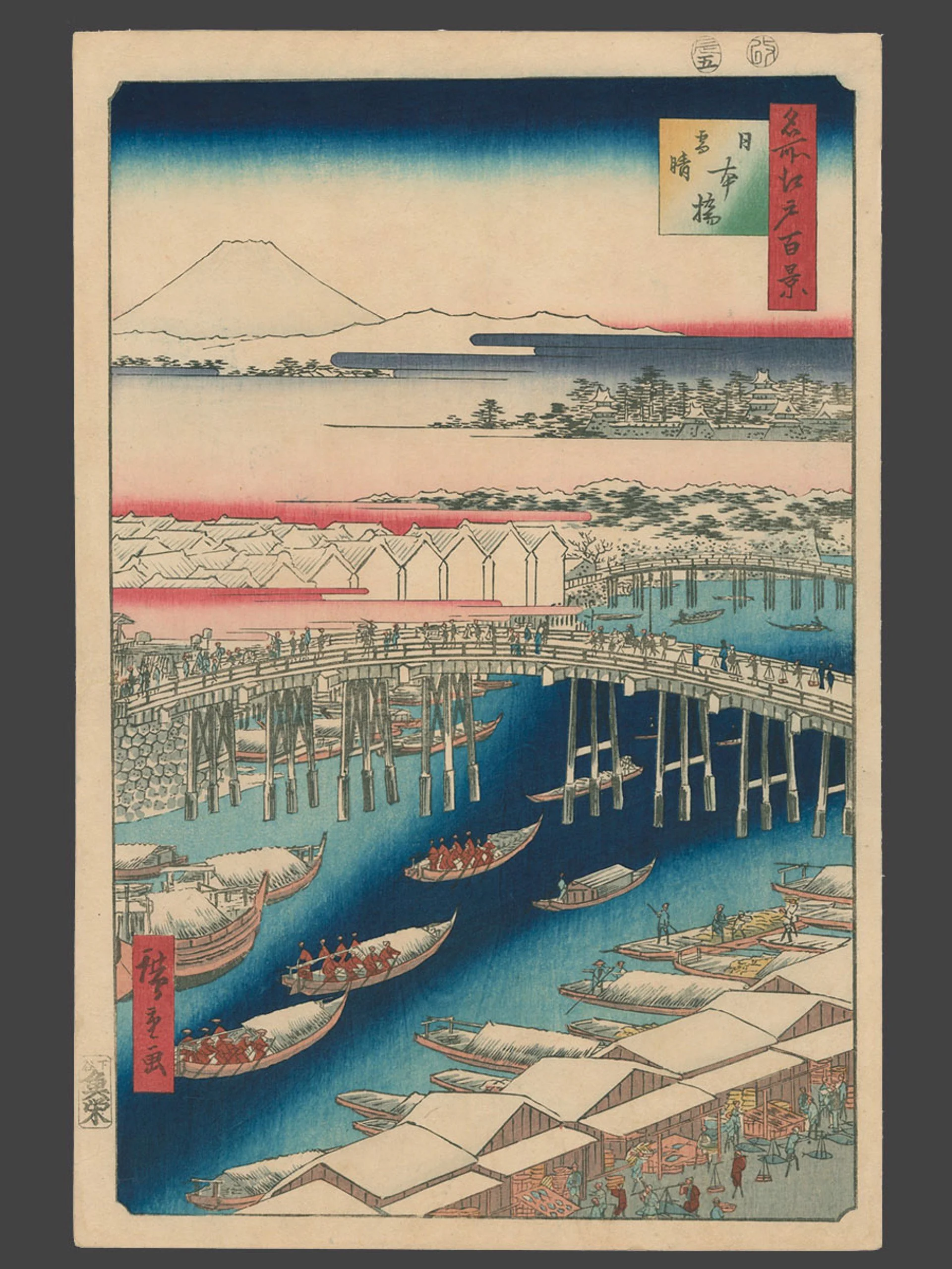 A Japanese ukiyo-e woodblock print of Nihonbashi Bridge after snowfall. Boats, rooftops, and Mount Fuji appear under a gradient winter sky by Hiroshige.