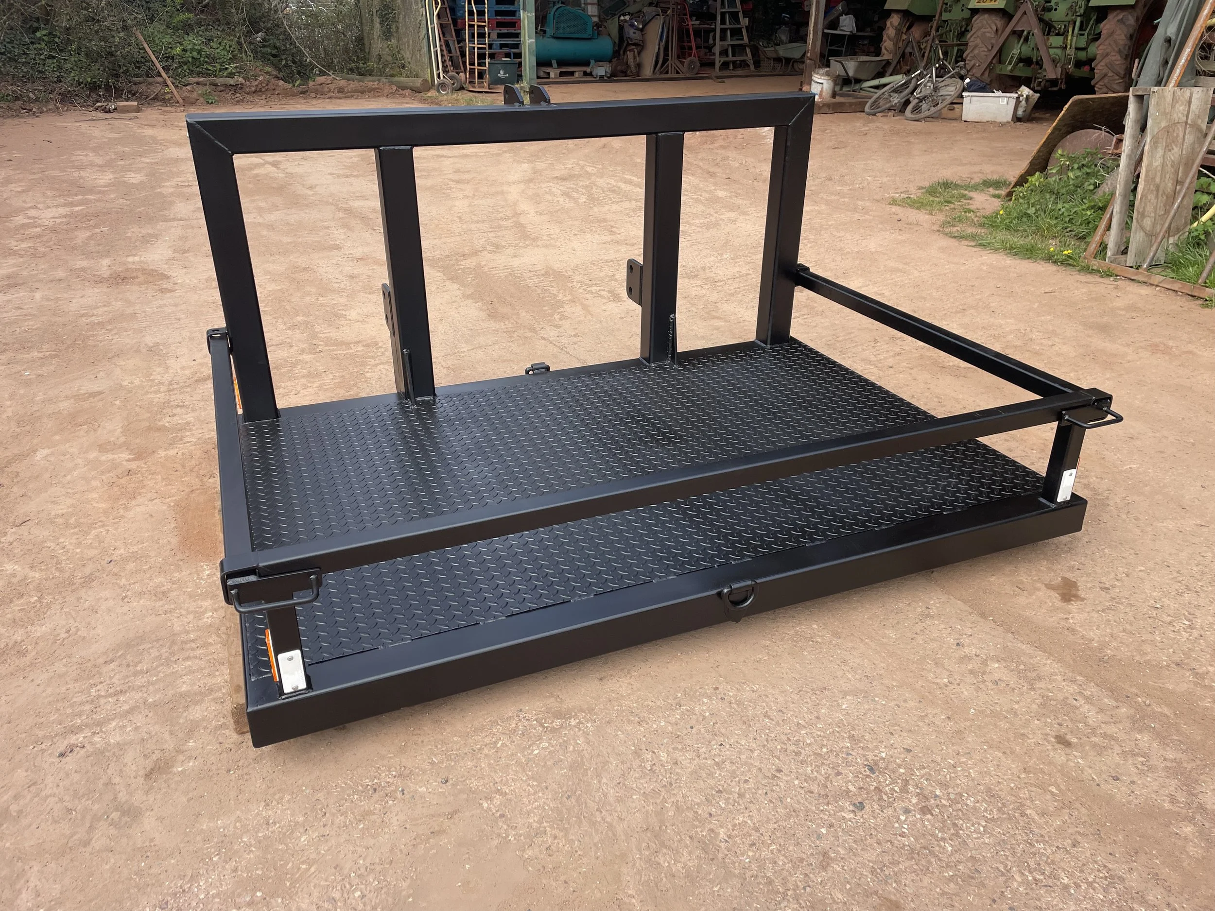 Quadbike holder fabricated for the front of a tractor