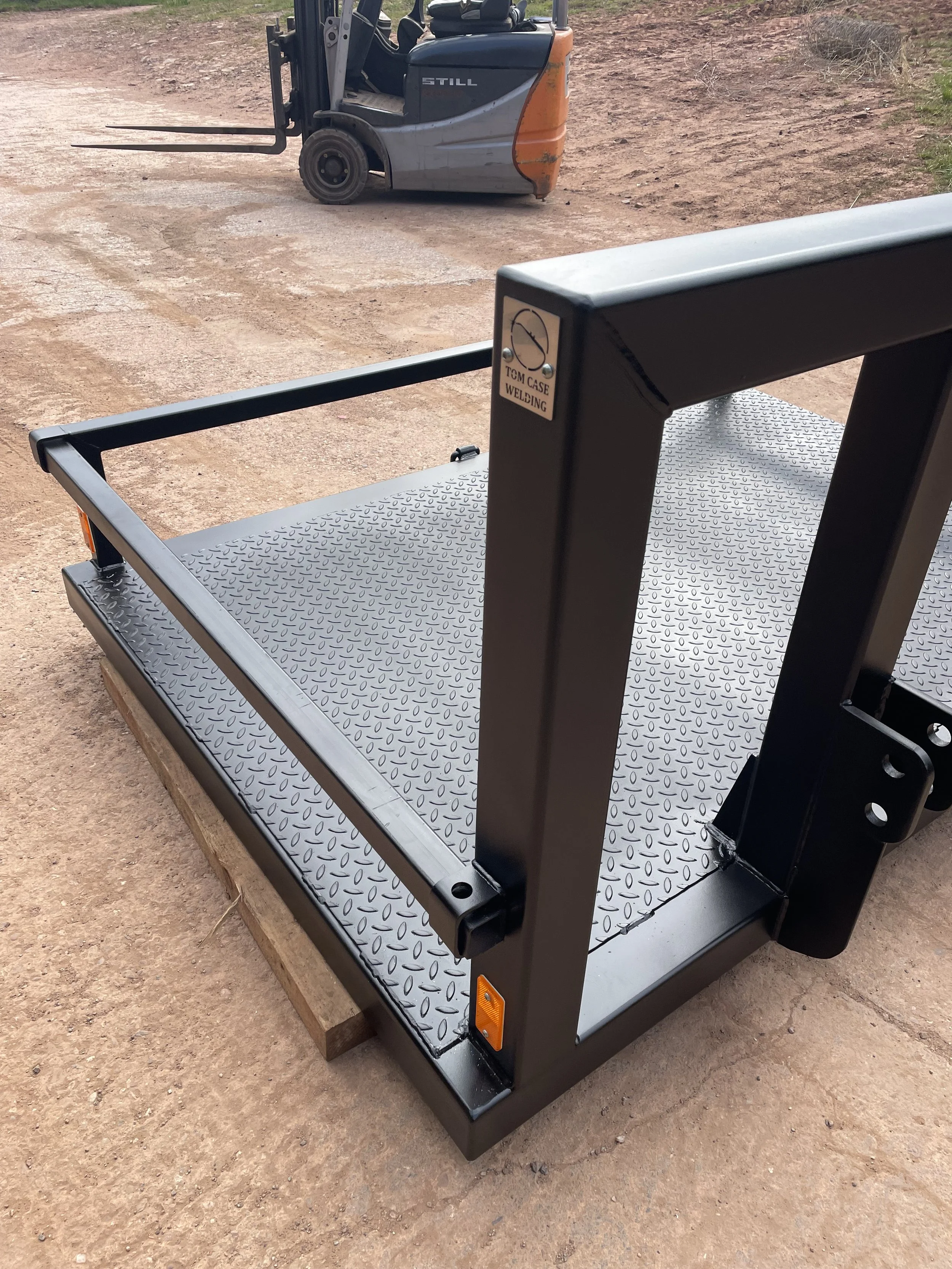 Quadbike holder fabricated for the front of a tractor