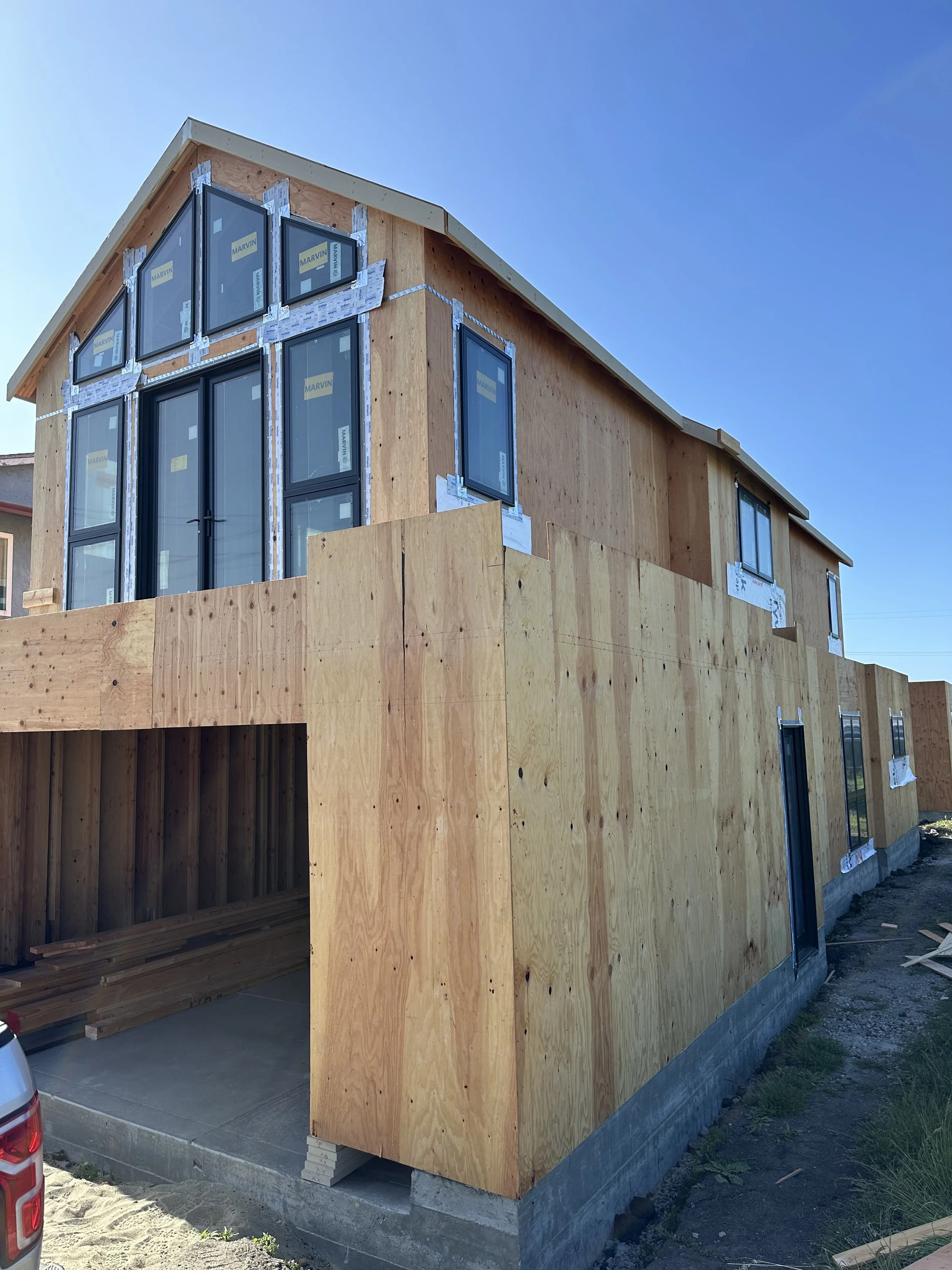 Oranssi technician working on a roof project