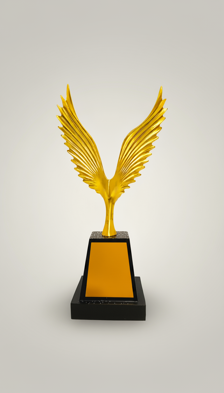 A trophy with a gold winged sculpture on top, mounted on a black base with an orange plaque.