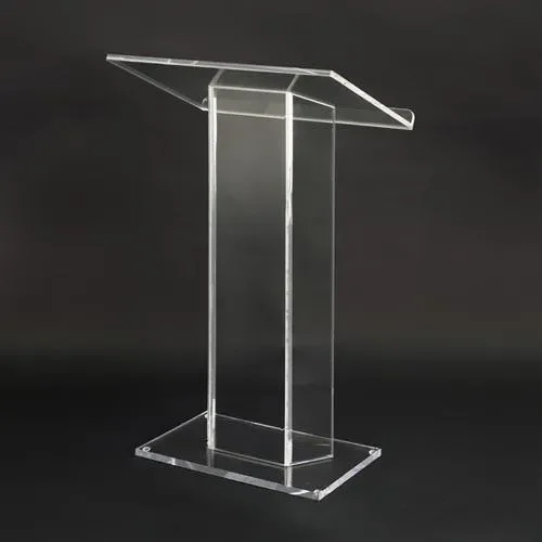 Clear acrylic podium with a slanted top, standing on a black background.