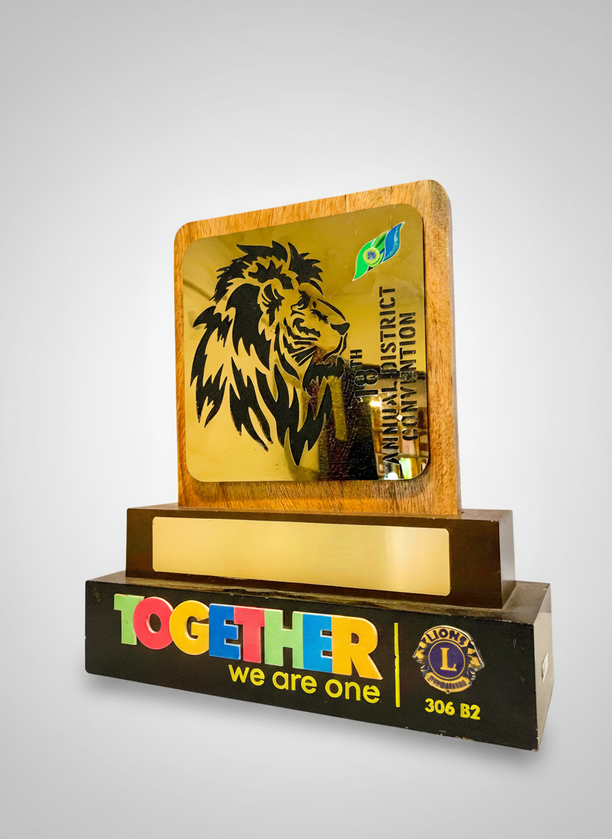 A plaque with a lion's head and the text "TOGETHER we are one."