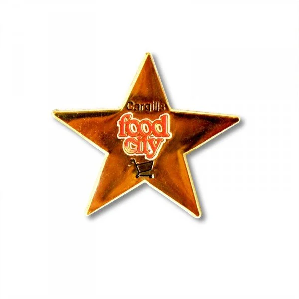 A star-shaped badge with the text 'Cargill's Food City' and a shopping cart icon in the center.