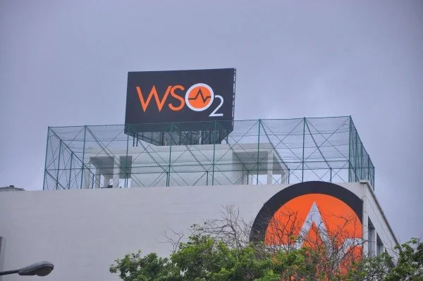 Building with a sign that reads "WSO2" and a circular logo with an orange background and a white "W" on it.