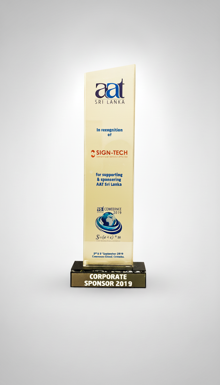A trophy with a beige rectangular body and black base, inscribed with the words "Corporate Sponsor 2019".