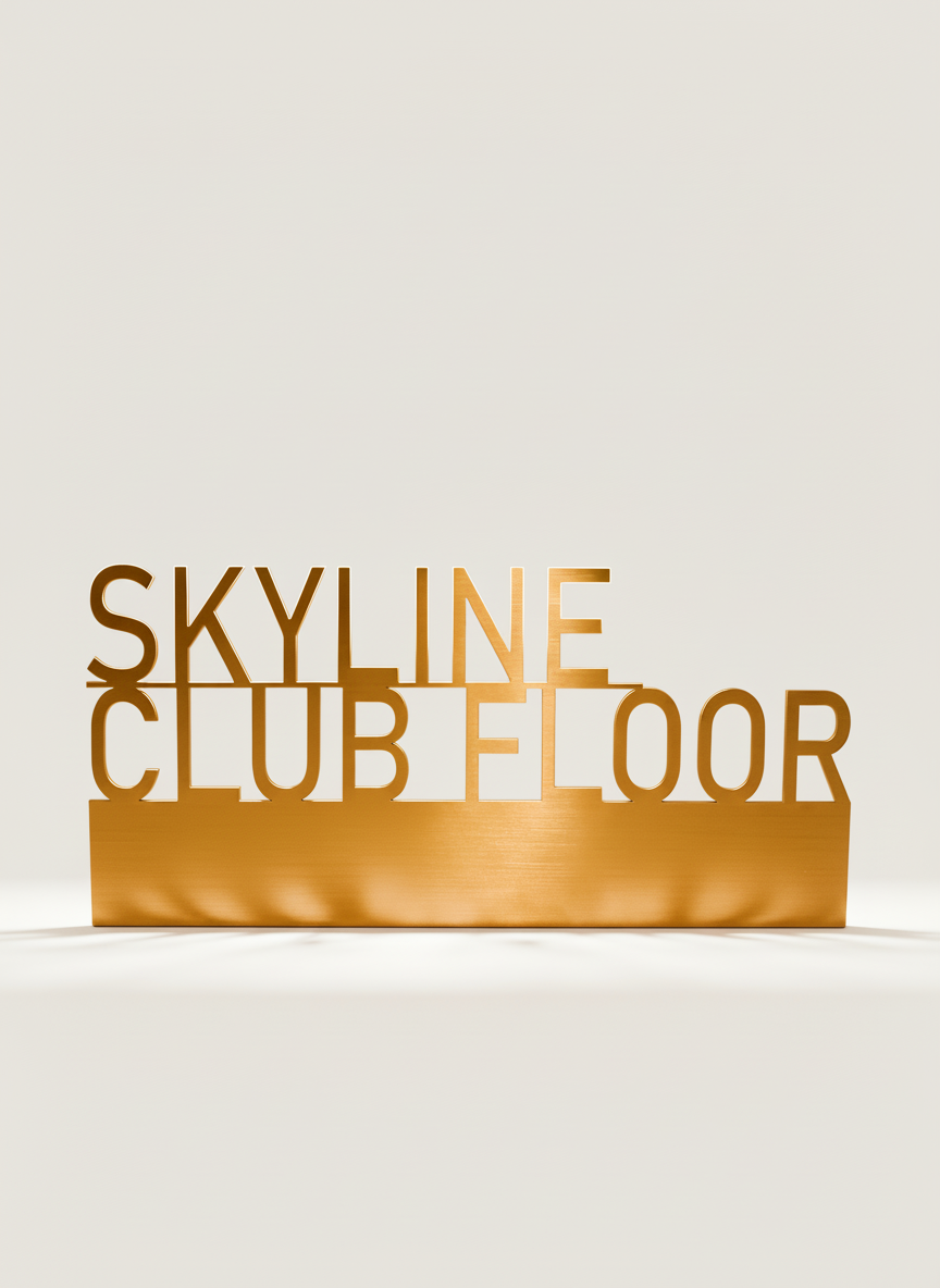 Gold-colored sign with cut-out letters spelling 'Skyline Club Floor' on a plain white background.