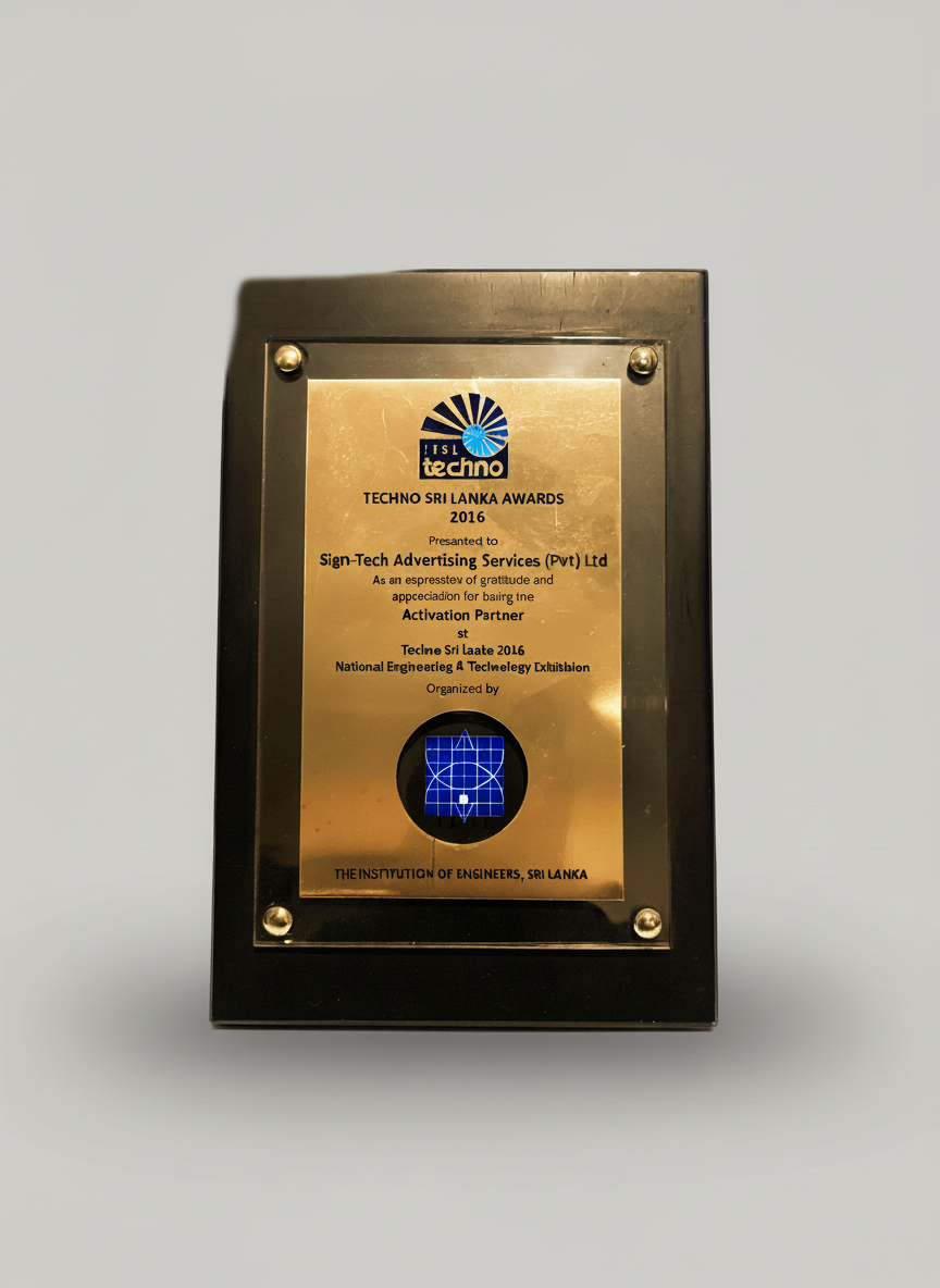 Plaque with the logo of ITS Techno and text stating it is an award from the Techno Sri Lanka Awards 2016, given to Sign-Tech Advertising Services (Pvt) Ltd for their contribution to electrical engineering at a national exhibition organized by the Ins
