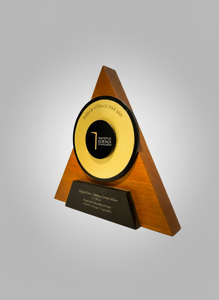 Triangular award trophy with a circular black and yellow face, inscribed with 'World Science Day 2019' and 'National Science Foundation', mounted on a black base with engraved text.