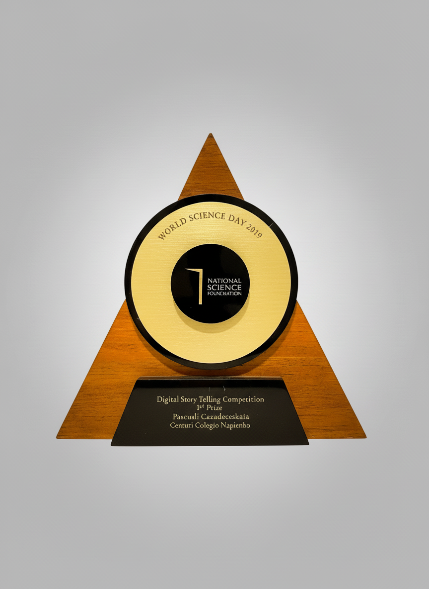 Award trophy with a circular face and a triangular wooden base, commemorating World Science Day 2019, presented by the National Science Foundation for first place in the Digital Story Telling Competition.