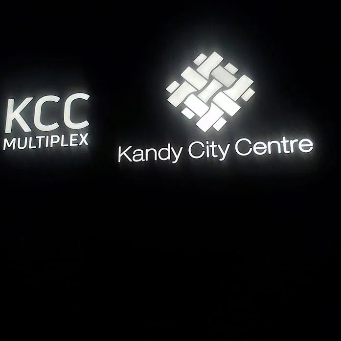 Sign with KCC MULTIPLEX and Kandy City Centre logos on a black background.