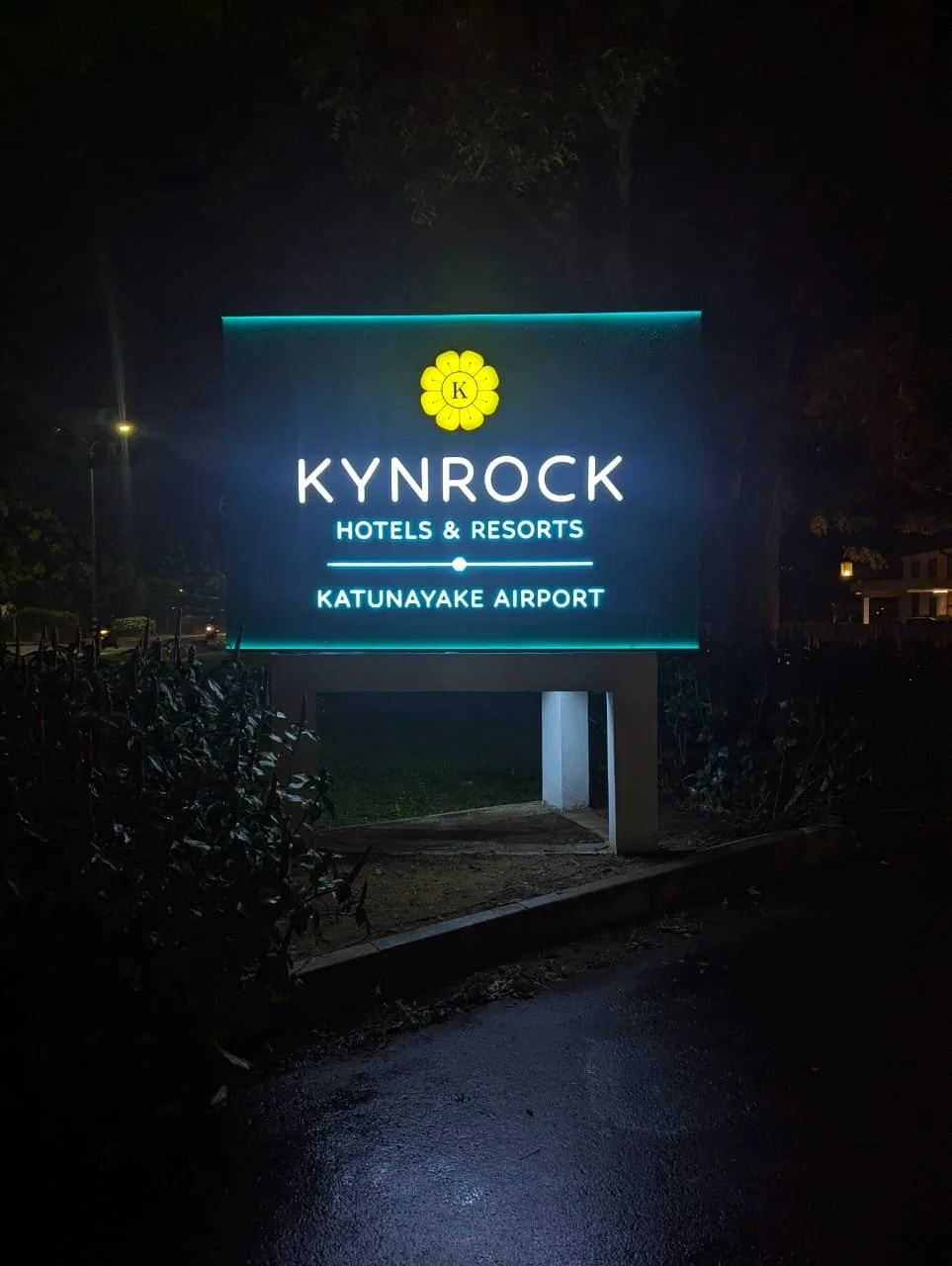 Illuminated sign for Kynrock Hotels & Resorts at Katunayake Airport at night