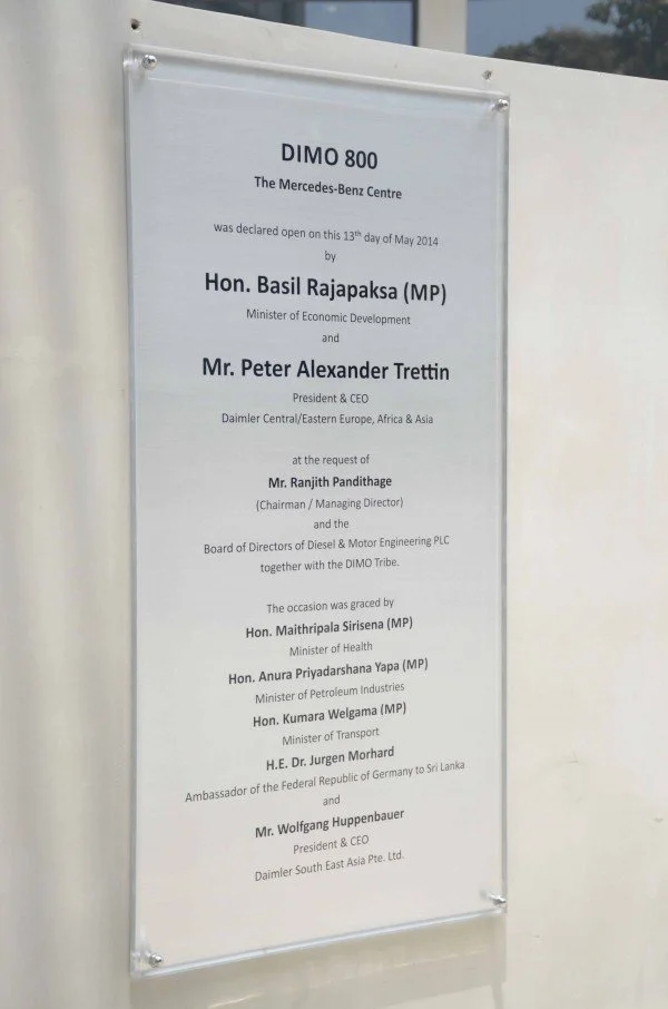 Plaque with text about the opening of DIMO 800 at Mercedes-Benz Centre, attended by Sri Lankan officials and representatives, dated May 13, 2014.