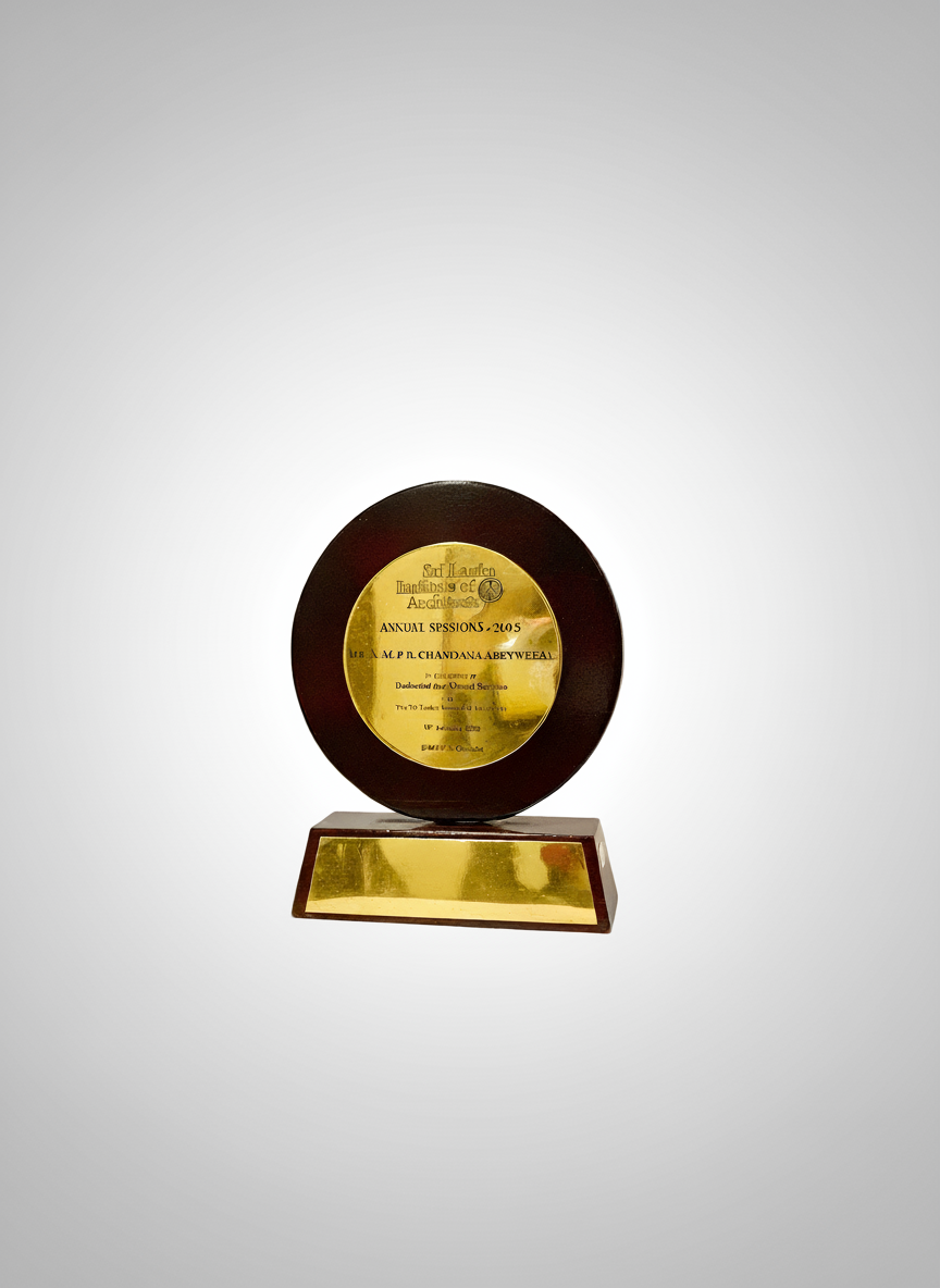 Award trophy with a circular black frame and a gold plaque on a rectangular base, commemorating the 2005 annual session of Sir Lankan organization.