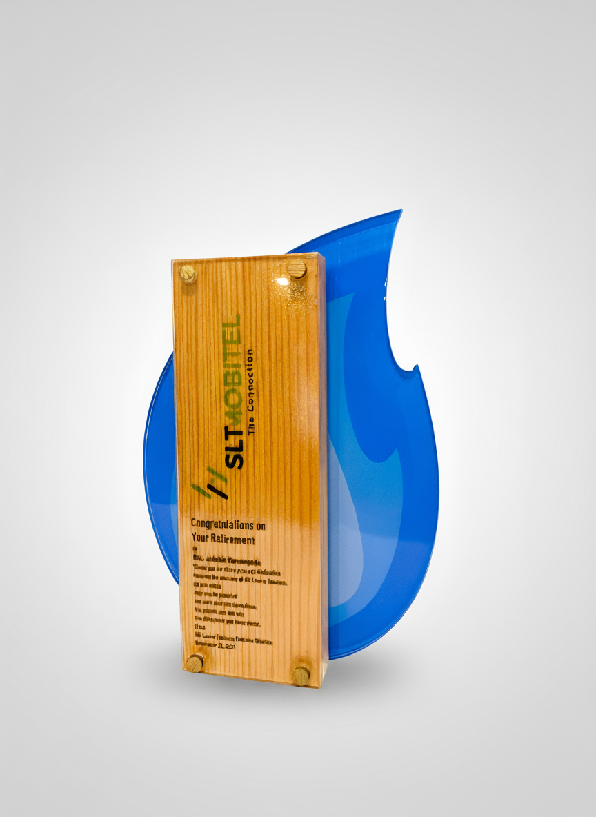 Blue sculpture with a wooden plaque in front of it, featuring an inscription and logo, displayed against a light background.