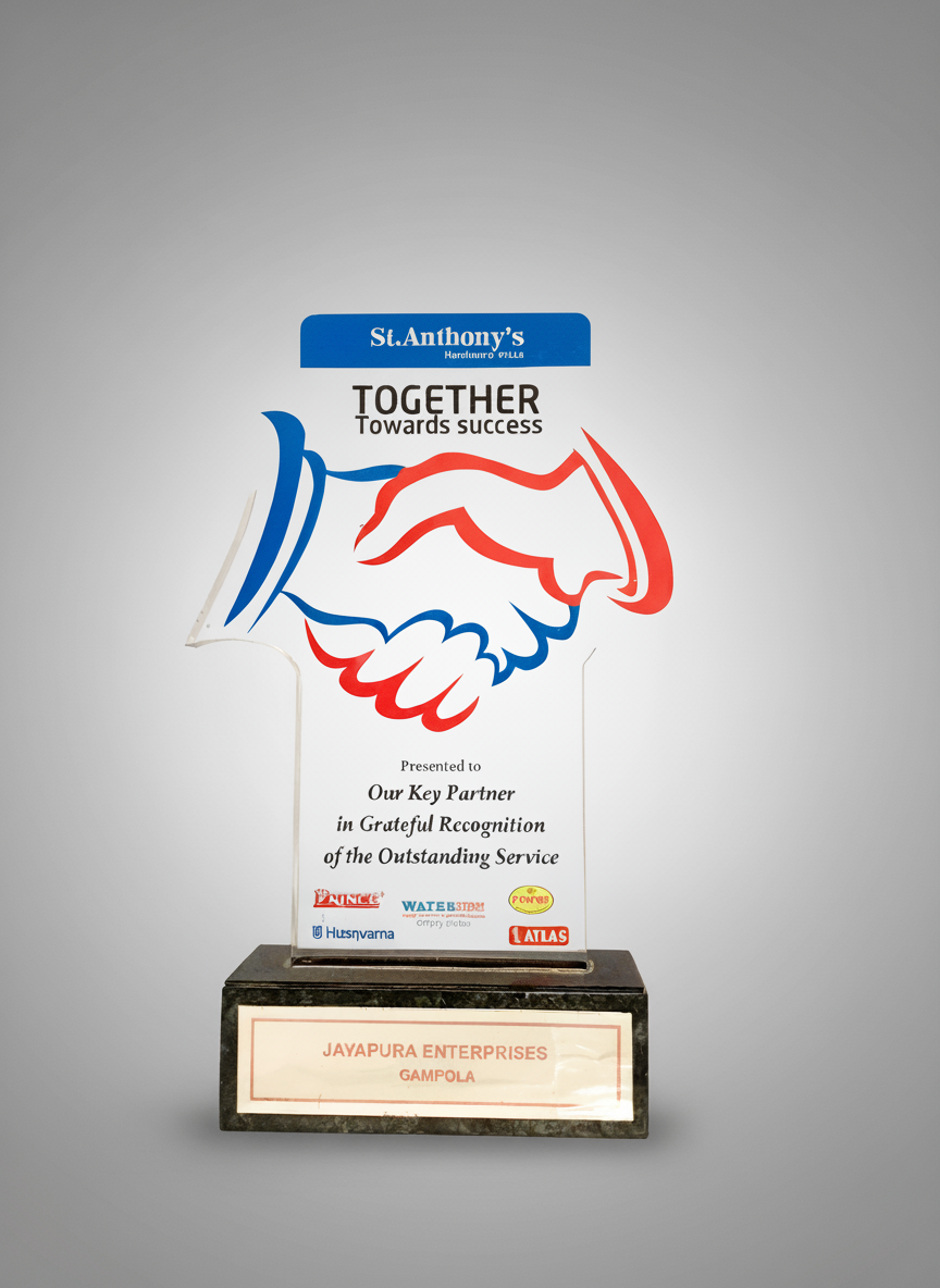 A recognition award plaque with a handshake graphic and the message "Together Towards Success" presented to Jayapura Enterprises, Gampola, with logos of various sponsors at the bottom.