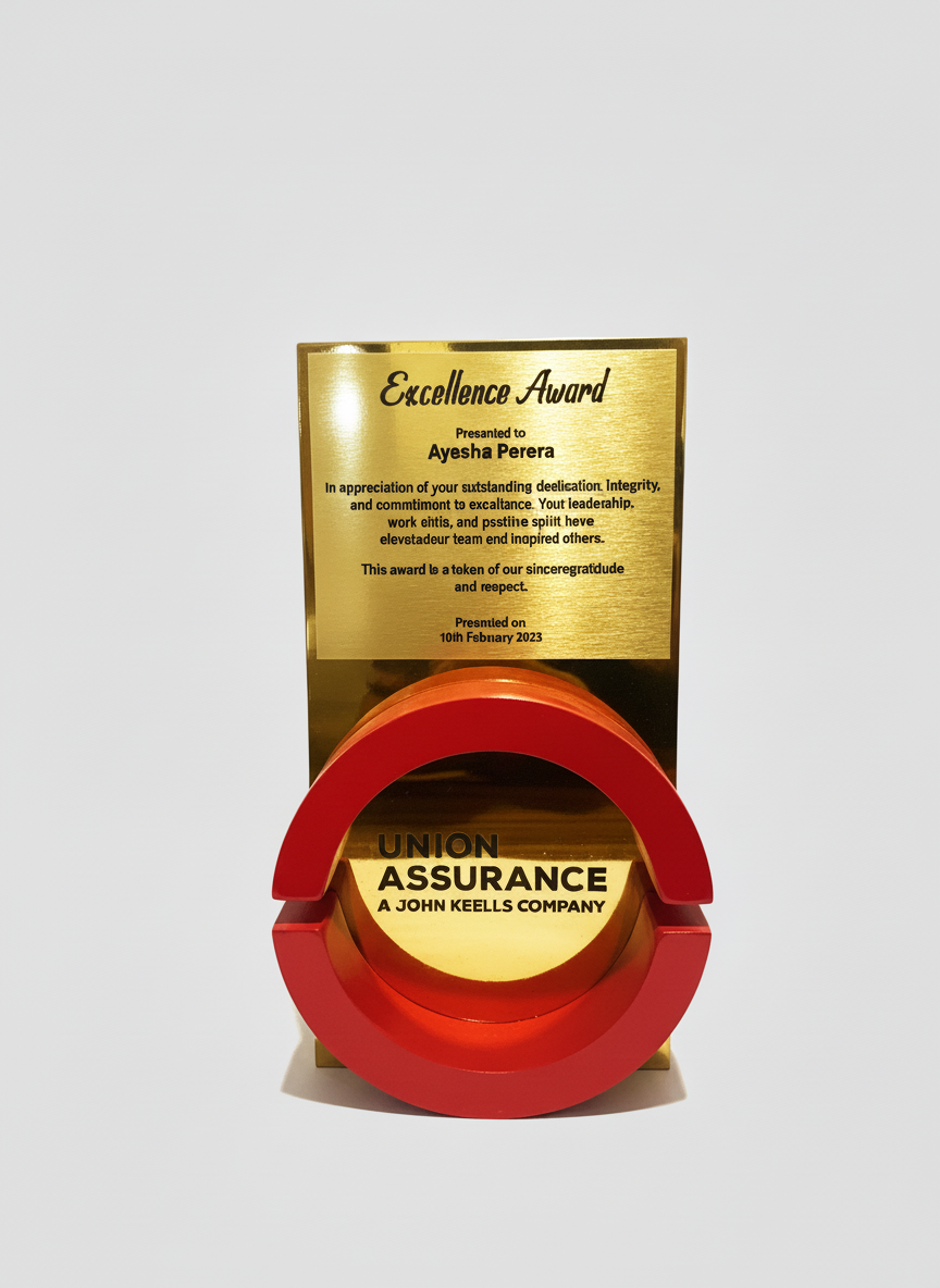 Gold award plaque with red circular frame below it, labeled "Union Assurance A John Keells Company."