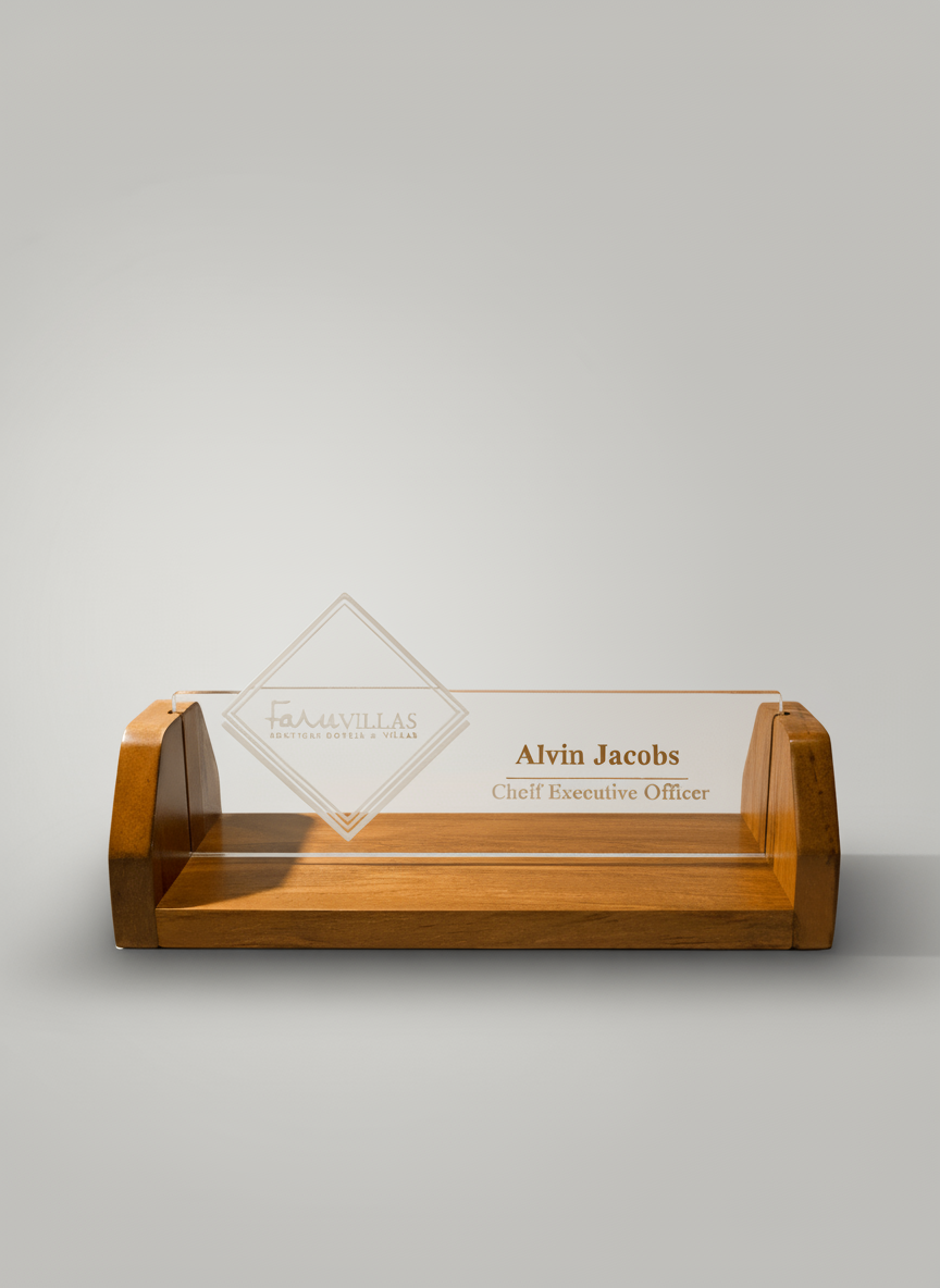Wooden desk nameplate holder with a clear acrylic nameplate displaying the name Alvin Jacobs and the title Chief Executive Officer.