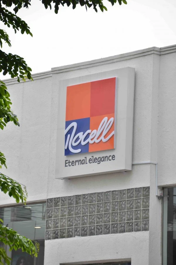 Store sign displaying a colorful logo with the name 'Nocelli' and the slogan 'Eternal elegance' underneath.