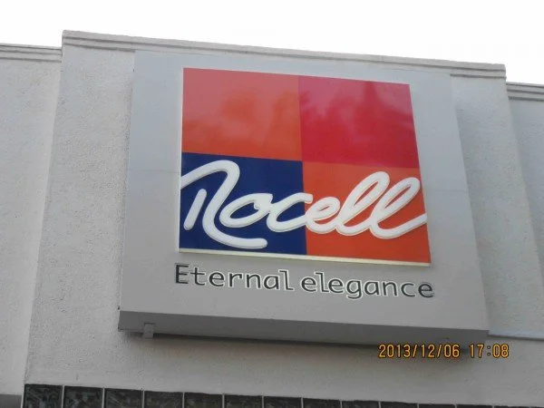Nocell logo with slogan 'Eternal elegance' on building wall