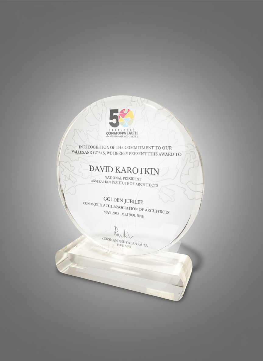 Clear glass award plaque with text and logo, celebrating a Golden Jubilee in May 2015, Melbourne.