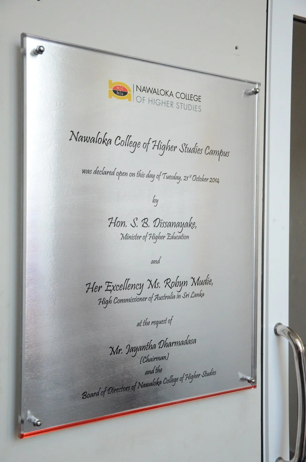 Plaque acknowledging the opening of Nawaloka College of Higher Studies Campus on October 21, 2014, signed by Hon. S. B. Dissanayake, Minister of Higher Education, and Her Excellency Ms. Robyn Mudie, High Commissioner of Australia in Sri Lanka, at the