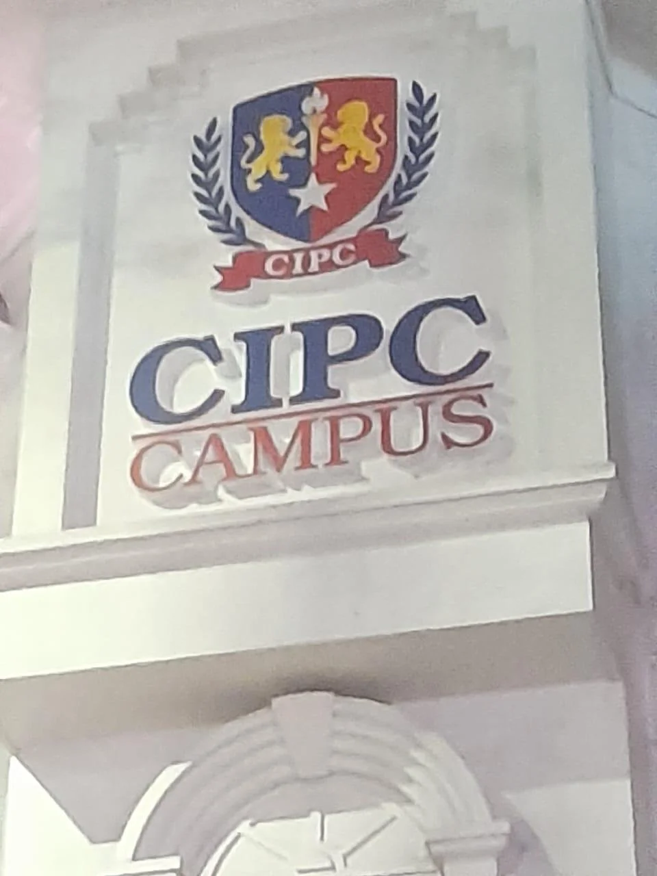 Sign for CIPIC campus with a shield emblem featuring lions and a star, and the text 'CIPIC CAMPUS'.