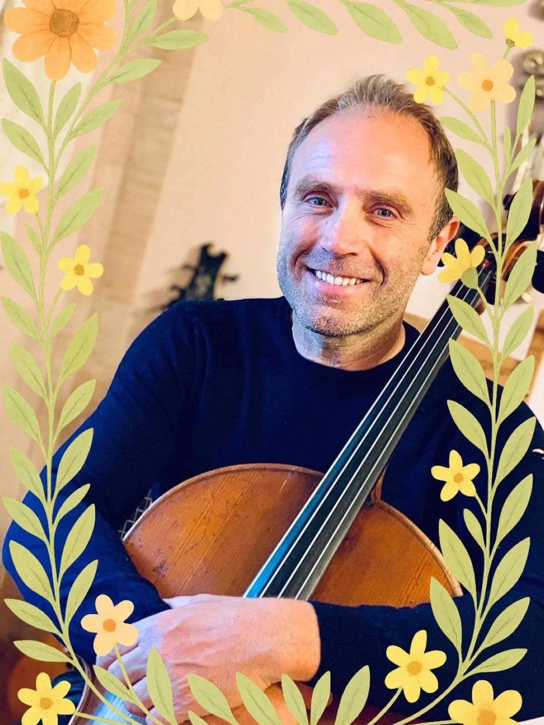 Smiling person holding a cello, surrounded by a floral border.