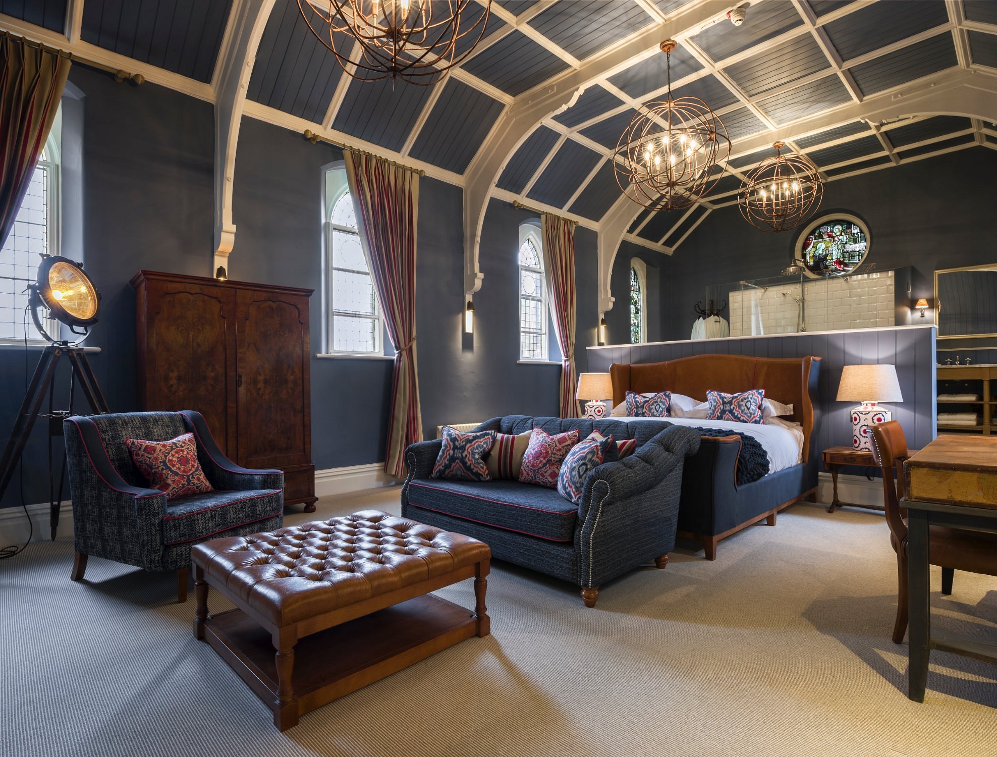 The Chapel suite is full of fine features, respectful to its original purpose, and maintaining its beautiful stained glass circular window. This room also includes an oversized heavenly bathtub for the perfect soak