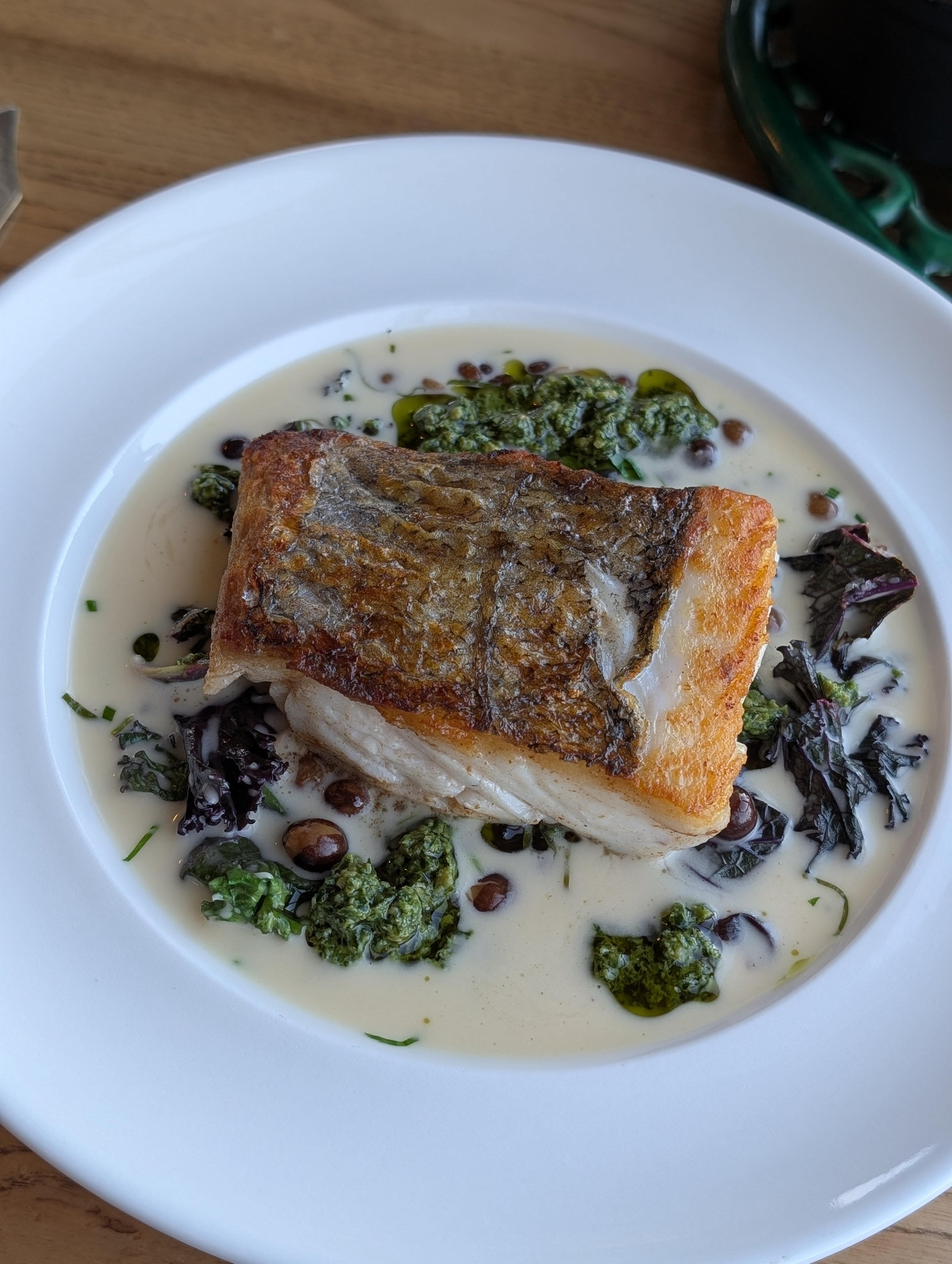 Roast Hake, Earthy Carlin Peas, Pungent Wild Garlic Verde, Zesty Lemon Butter: A Culinary Revelation