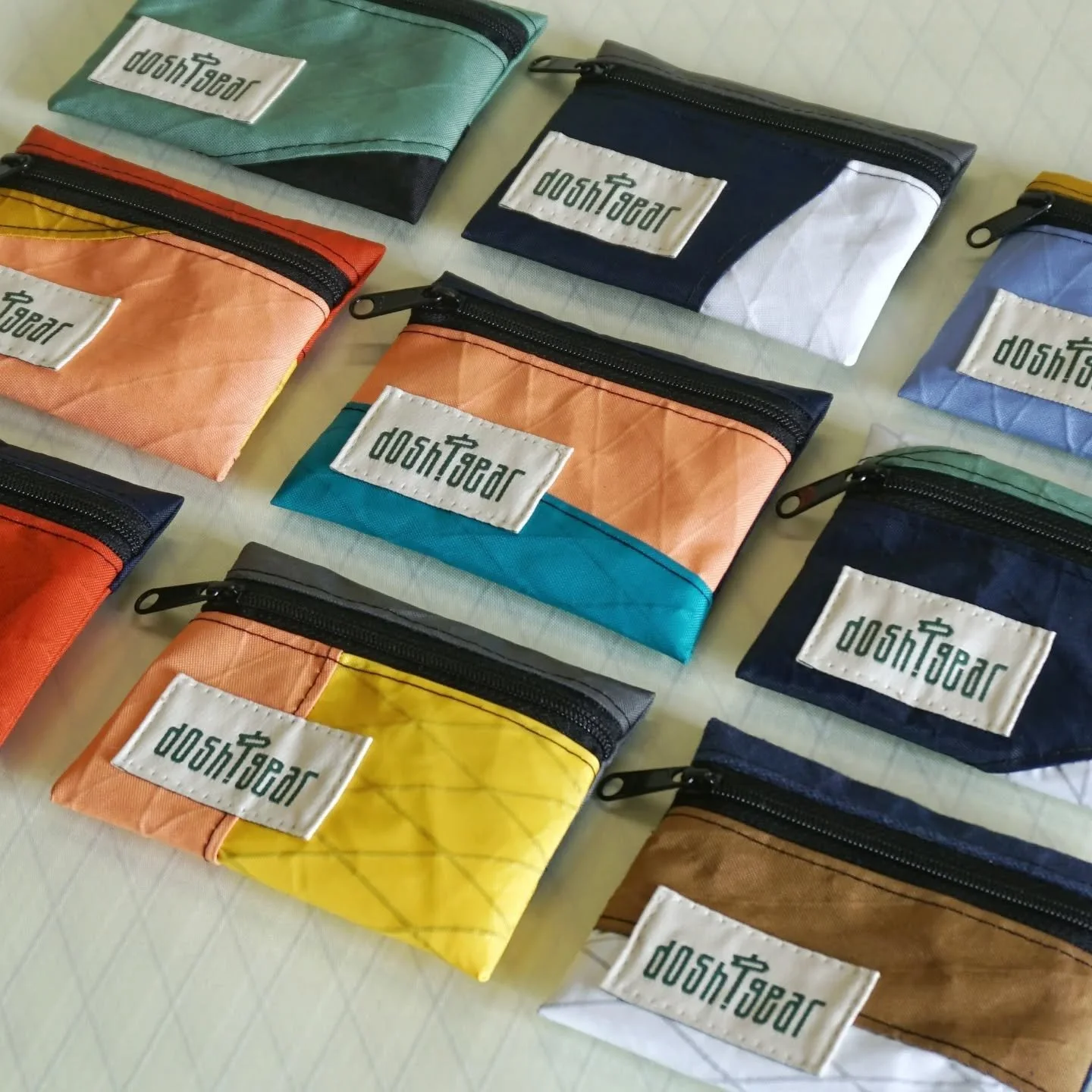 These ultralight wallets are made of pieces of fabric that get cut off in the production process of my bags. 

On average, big bag and clothing manufacturers calculate about %15 to %20 of fabric being lost due to cutting waste. It is difficult to say