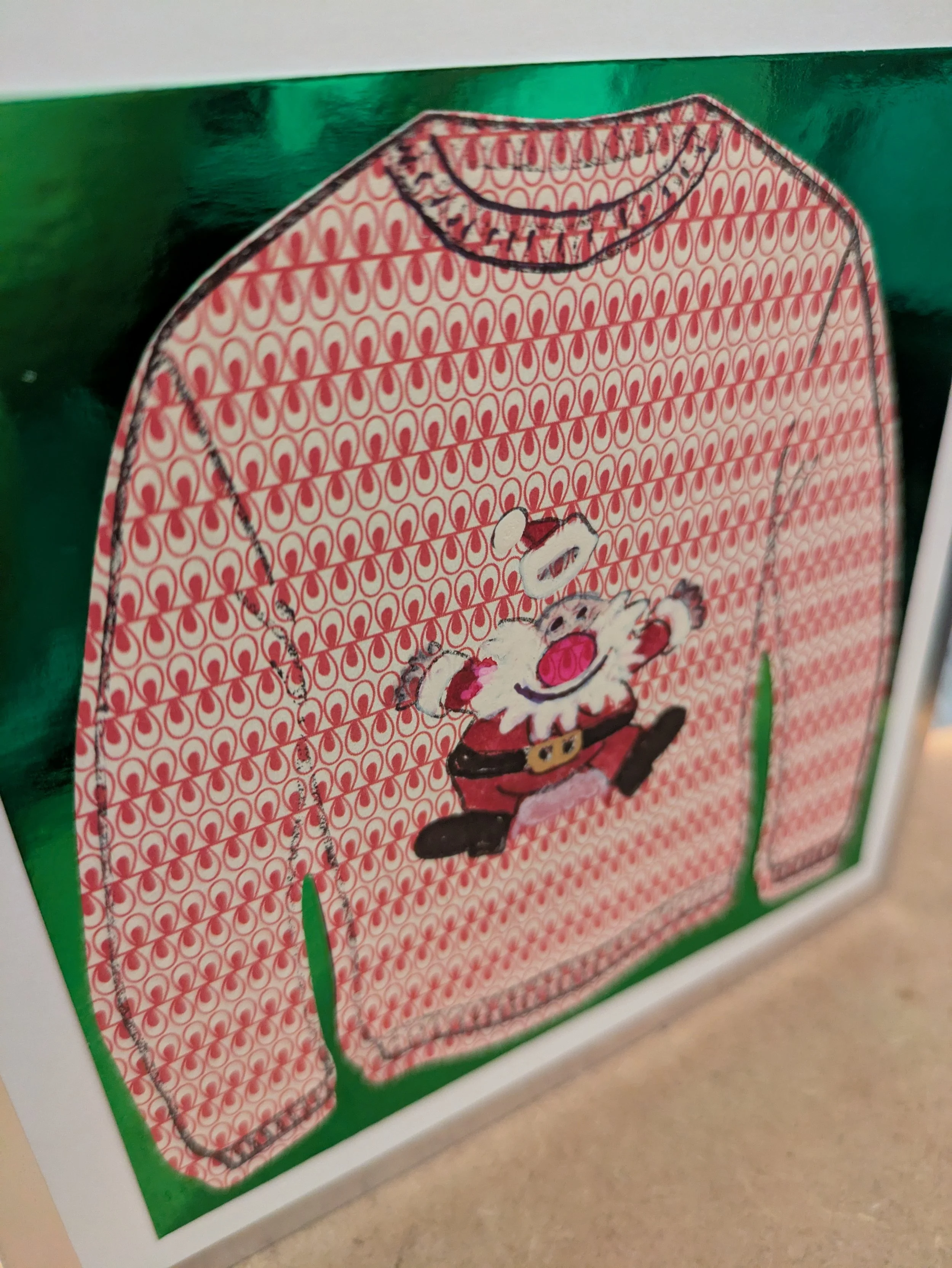 Santa traditional red xmas jumper. green mirror background.jpg