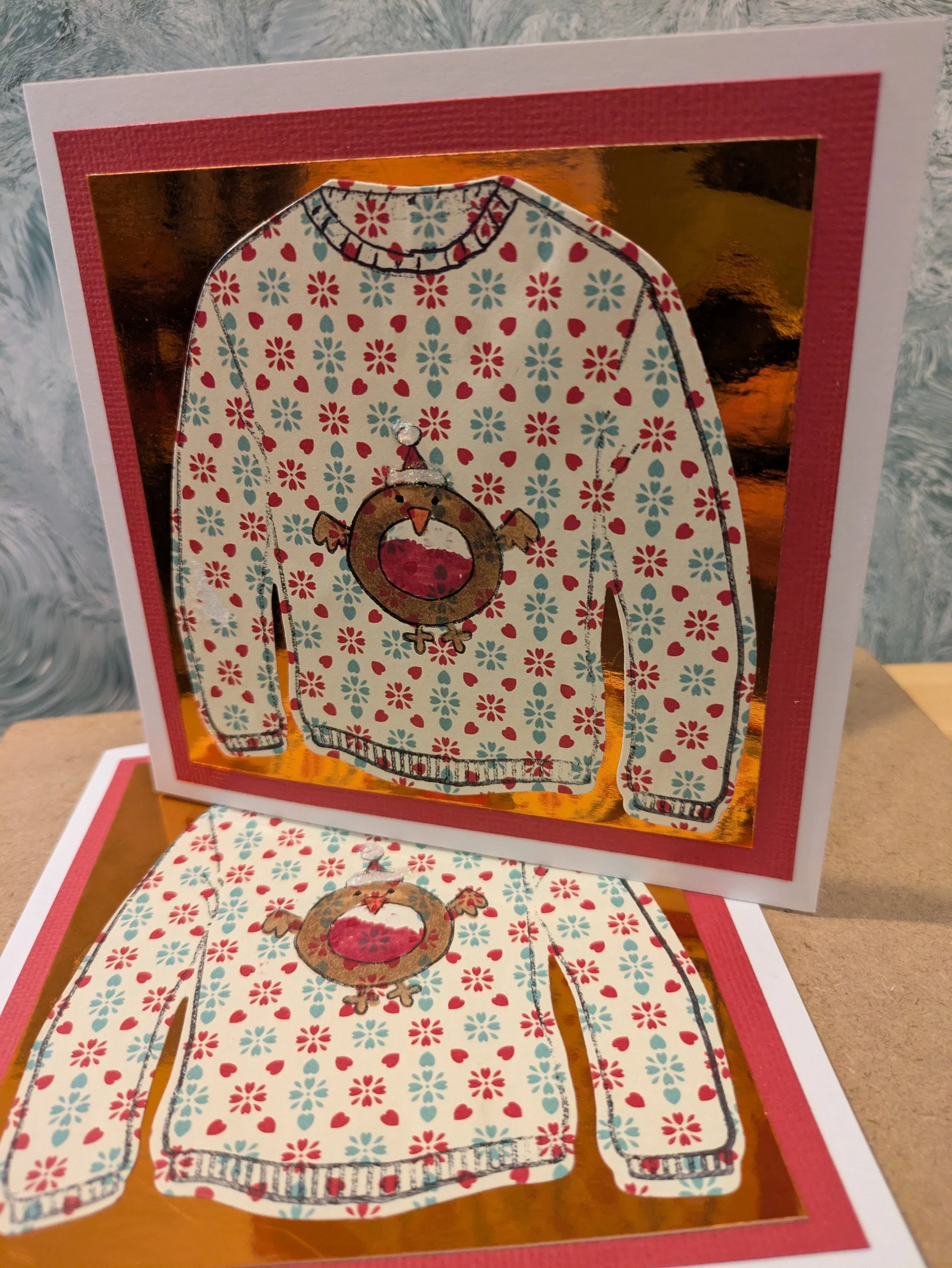 Robin traditional xmas jumper on a mirror card background.jpg