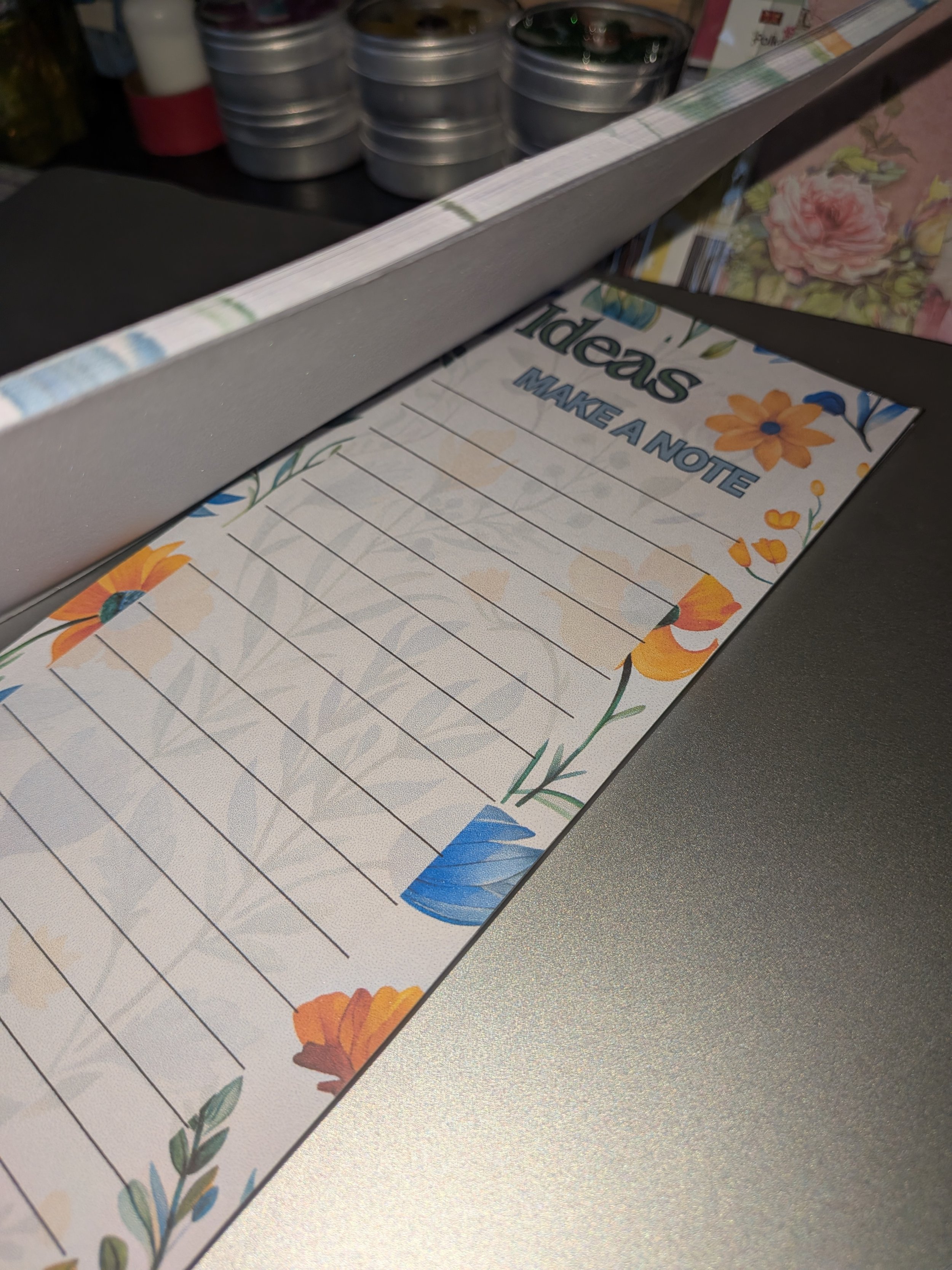 Notepad slim orange flowers side view.jpg