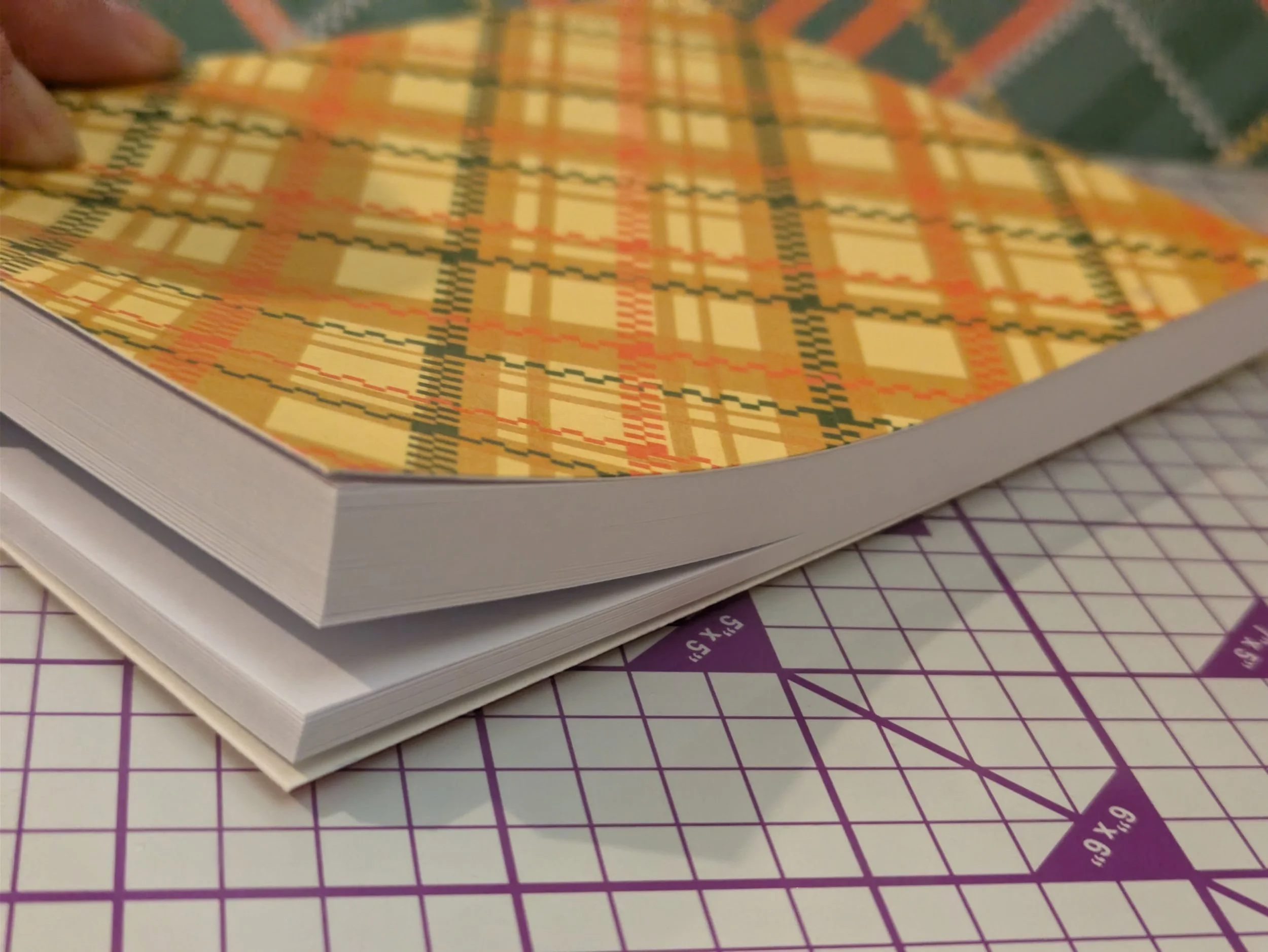 Notepad A6 yellow plaid showing pages.jpg