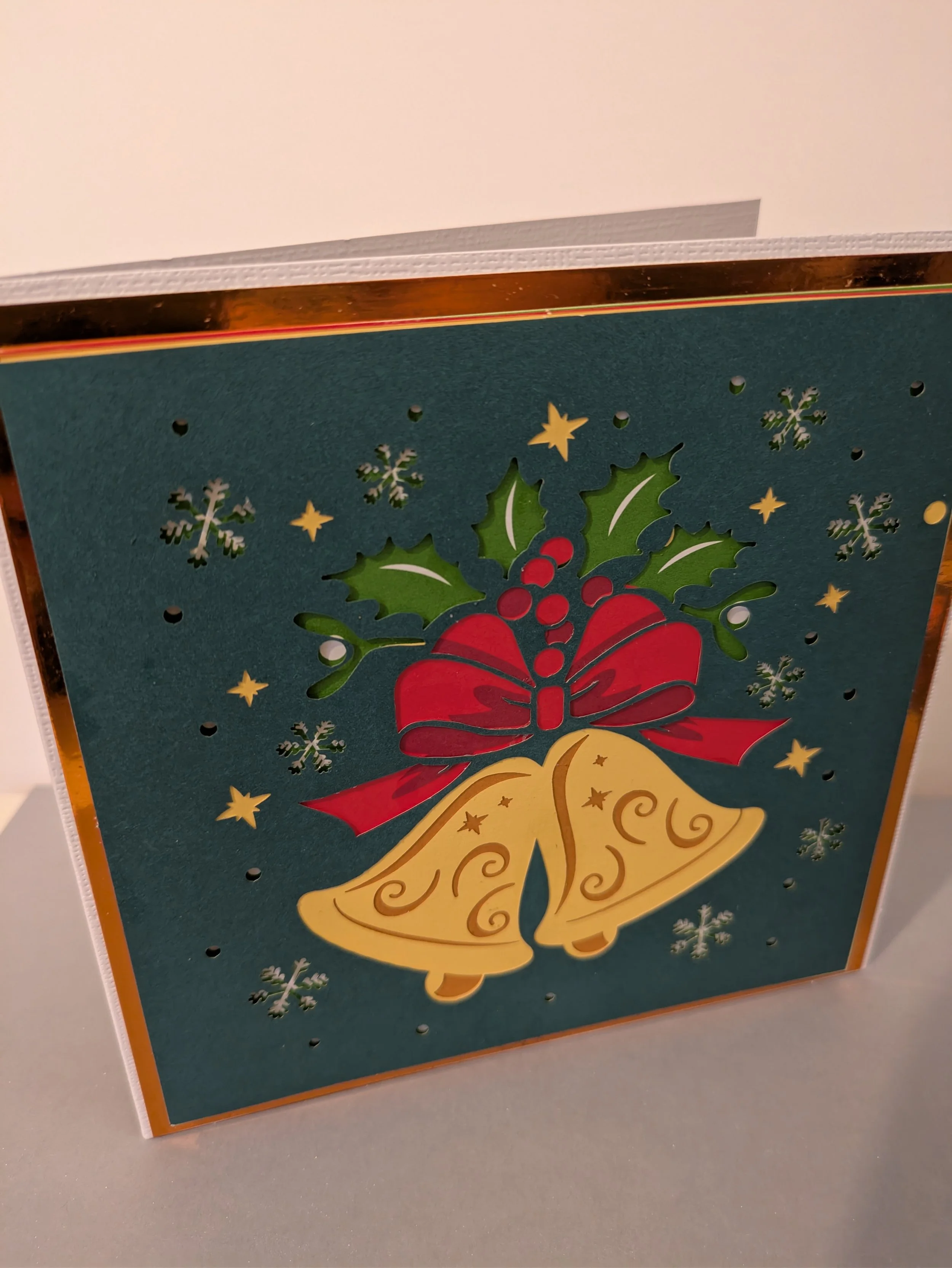 Xmas bells layered with bow.jpg