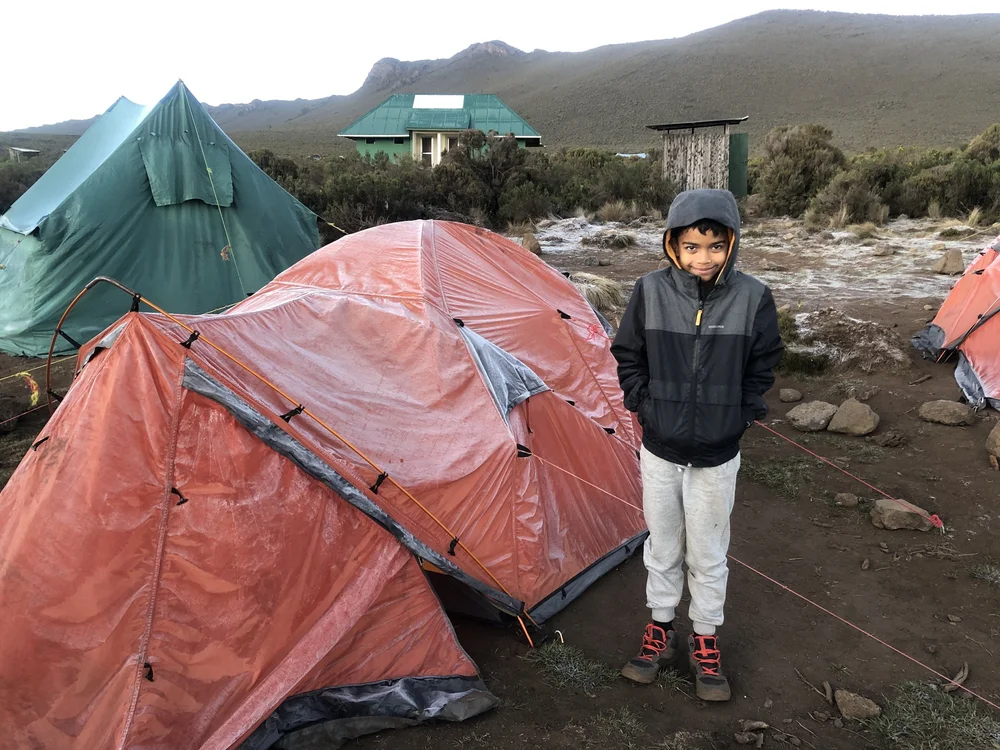 Param amused seeing the layer of ice on our tent, due to the sub-zero temperatures last night