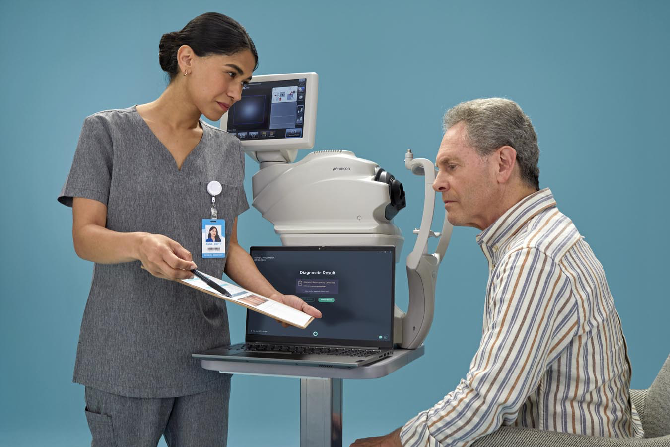 Image of the LumineticsCore machine with a tech and a patient