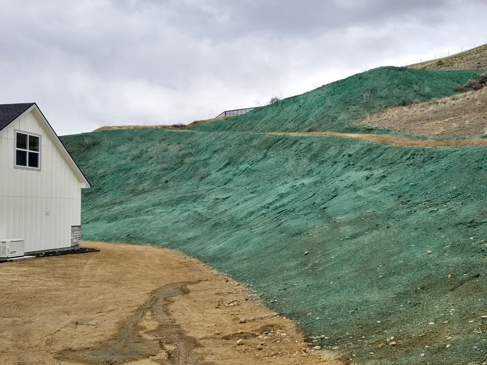 Hydroseed adheres to hillsides ensuring seed goes where it needs and stays there