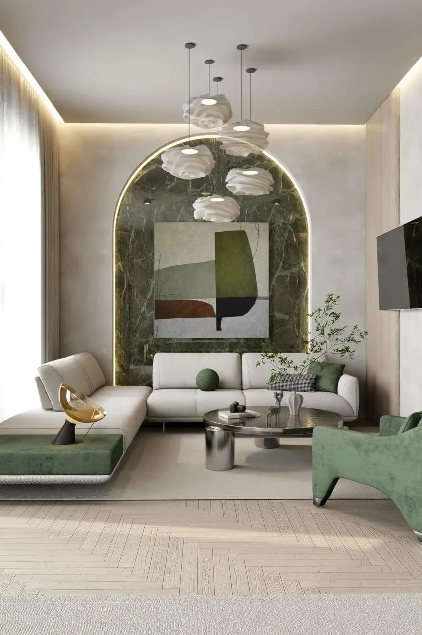 Modern living room with white sectional sofa, green armchair, abstract wall art, pendant lights, and a circular coffee table, featuring a mix of textures with wood flooring and plush accents.