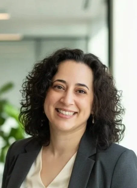 Portrait of Dr. Veronica Allende, educator and lifelong learner, sharing a personal testimonial about the Slay the Stock Market investing course and its impact on financial confidence and growth.
