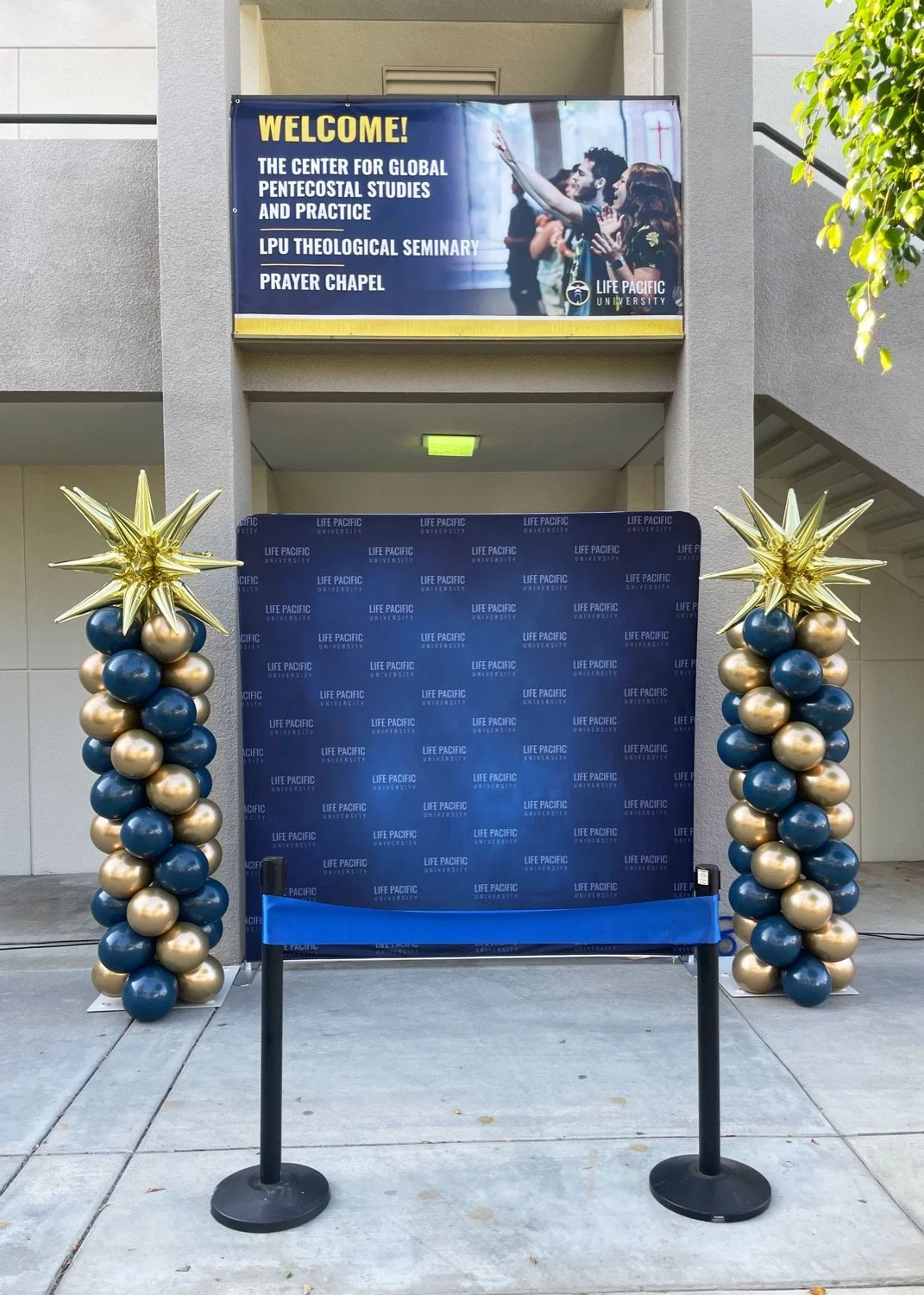 custom balloon column decor with gold star toppers for corporate event in southern california