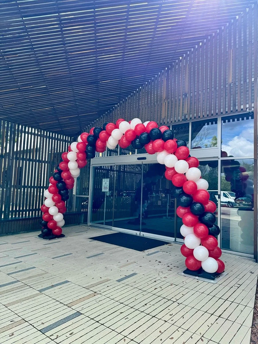 red black and white balloon arch for corporate event entrance in san dimas ca