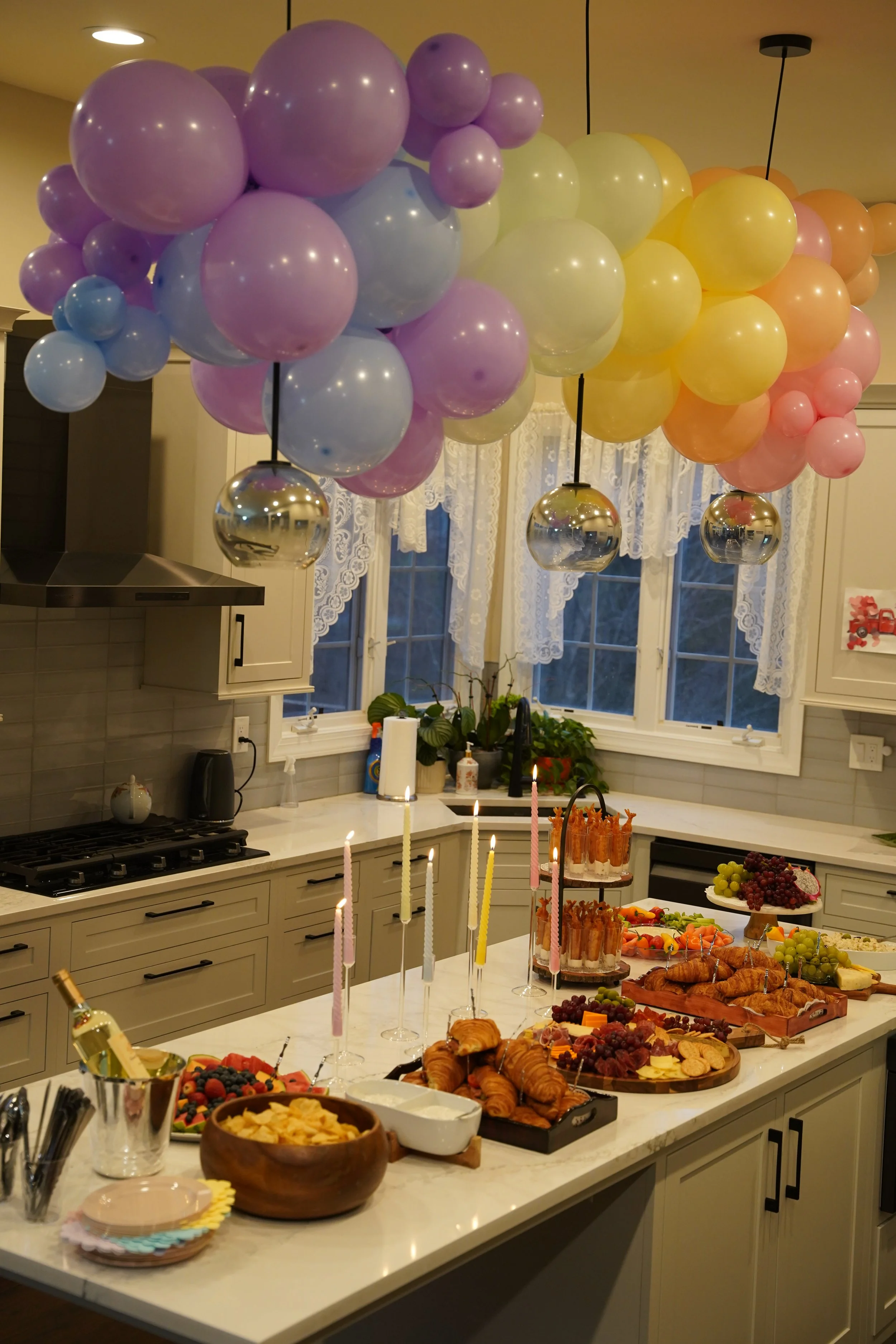 kids-birthday-owl-rainbow-theme-pastel balloons-kids-activity-personalized celebrations-design-rainbow -theme-appetizer table design-rainbow -theme-cheeseboard-shrimp tower-fruit palter 