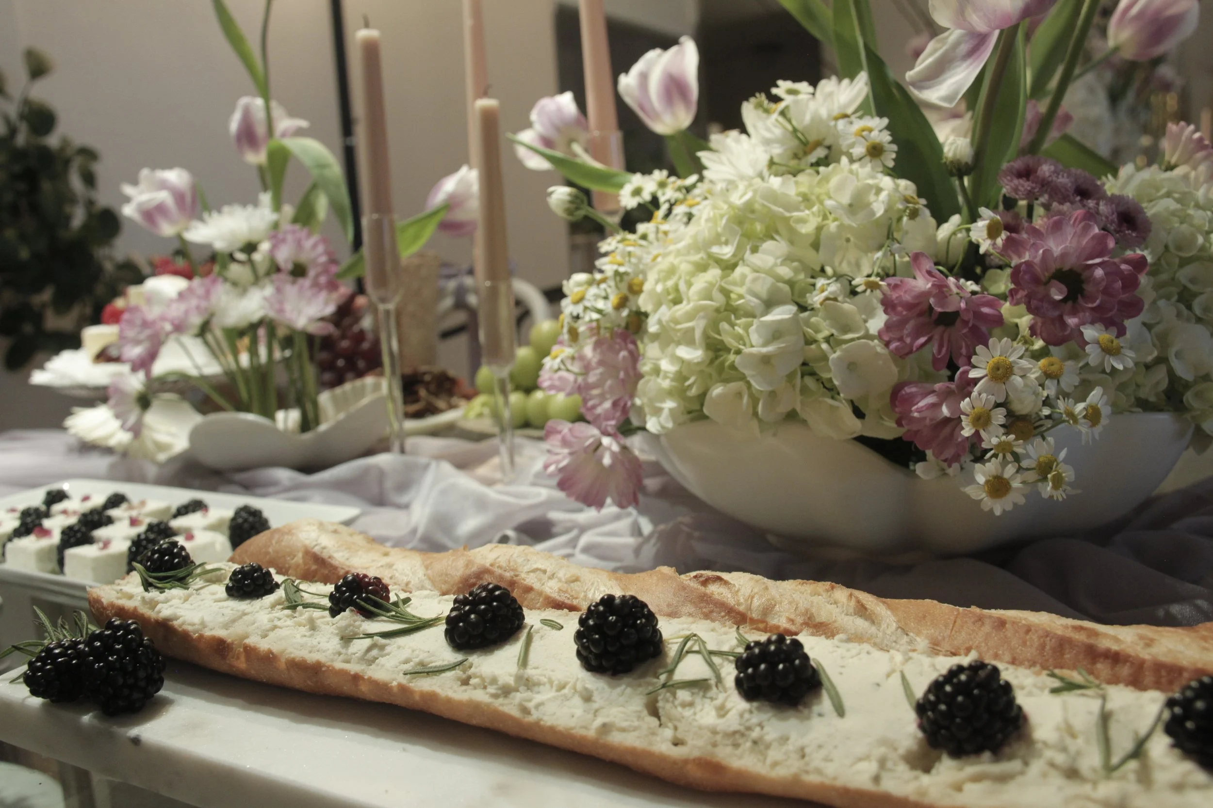 birthday-flower design-personalized celebrations-appetizer table design-purple-burgundy-theme-bloom-birthday-theme-elegant design- blackberry and chees and bread