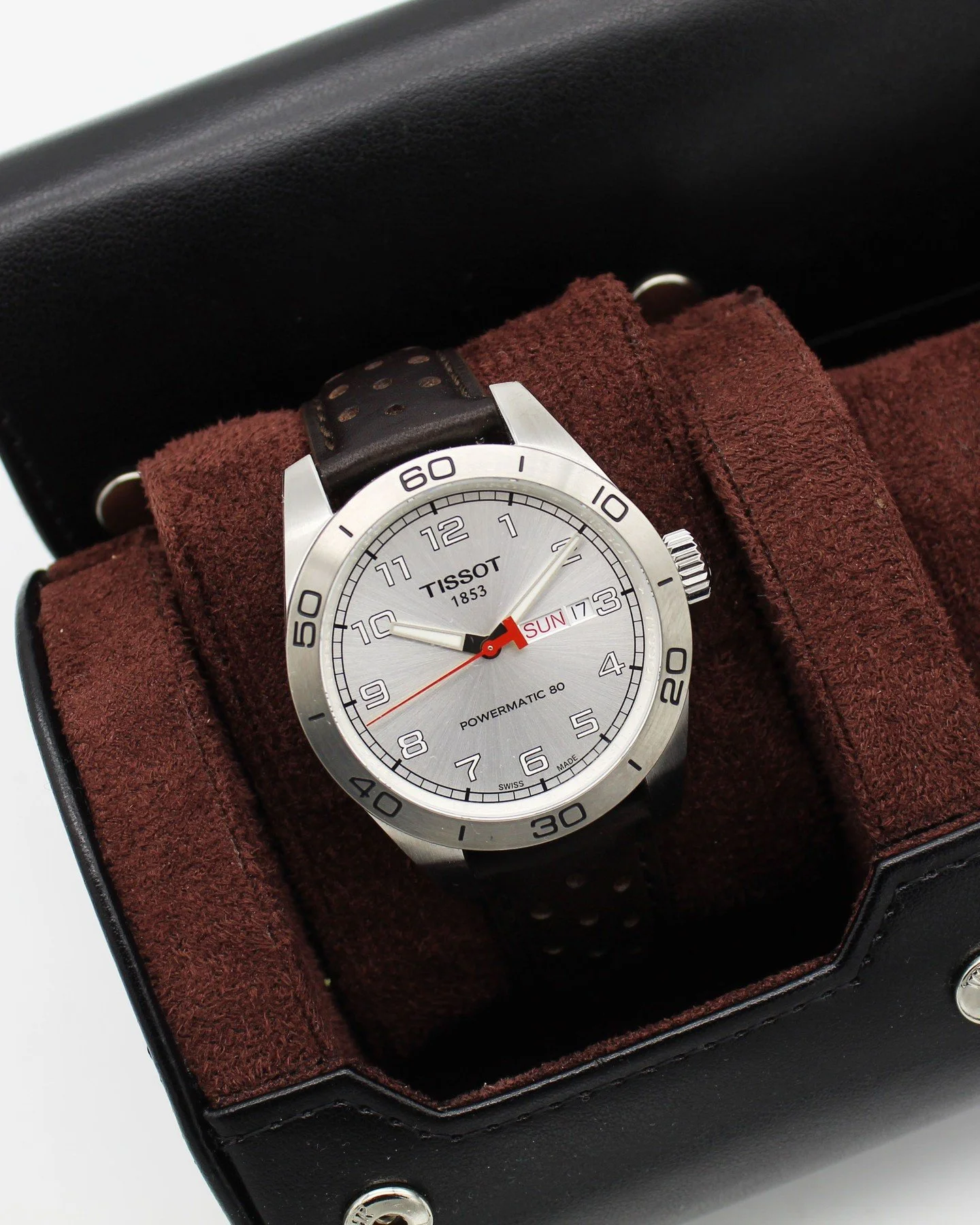 Tissot PRS 516 Day-Date Powermatic 80 🏁⌚

Sporty and clean, this PRS 516 features a silver dial with bold Arabic numerals, a red seconds hand, and a practical day-date at 3 o&rsquo;clock. The brushed steel bezel and perforated leather strap add that