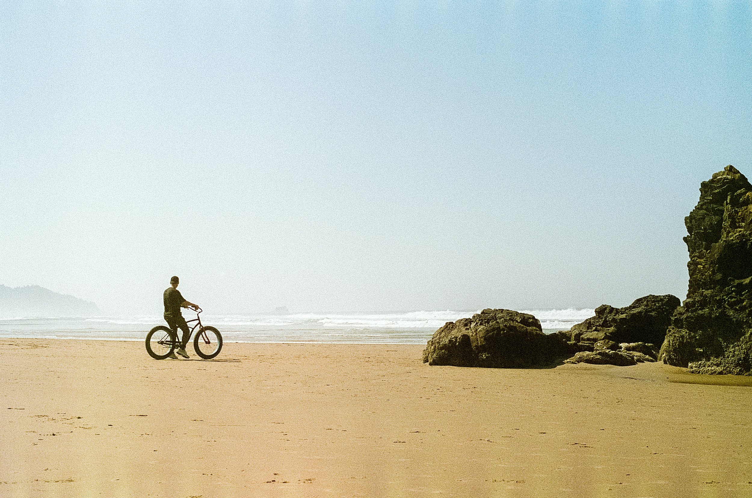 Biker on beach. Cannon Beach 2023