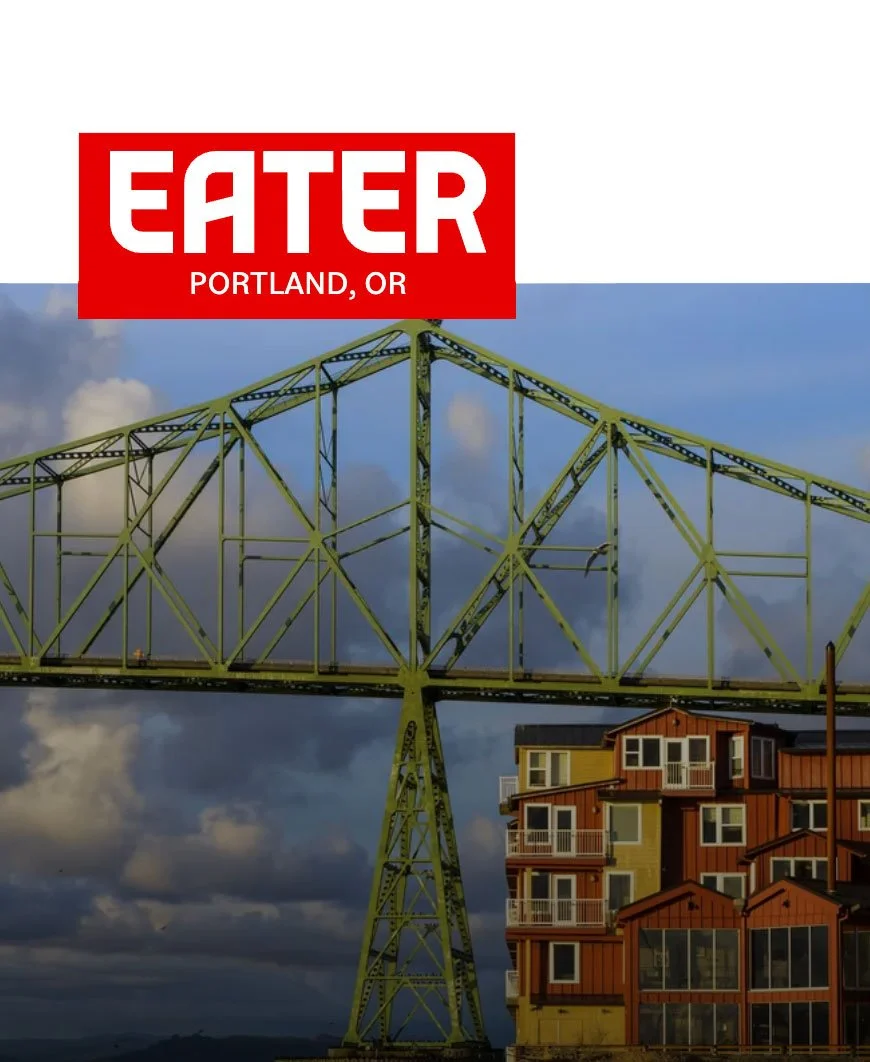 Green steel bridge with cloudy sky in Portland, OR